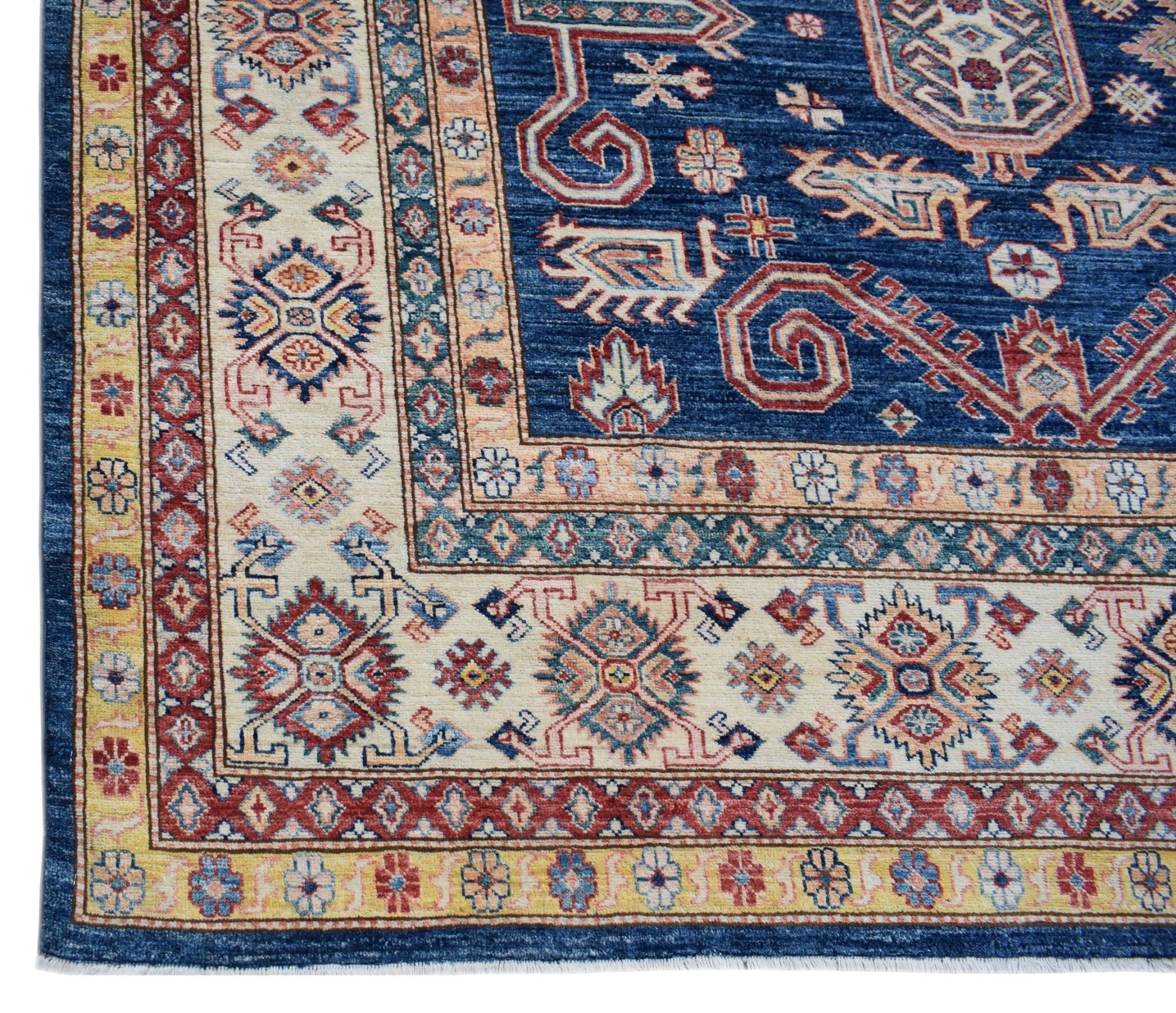 A handmade Afghan Super Kazakh rug featuring traditional geometric motifs in blue, red, and cream.