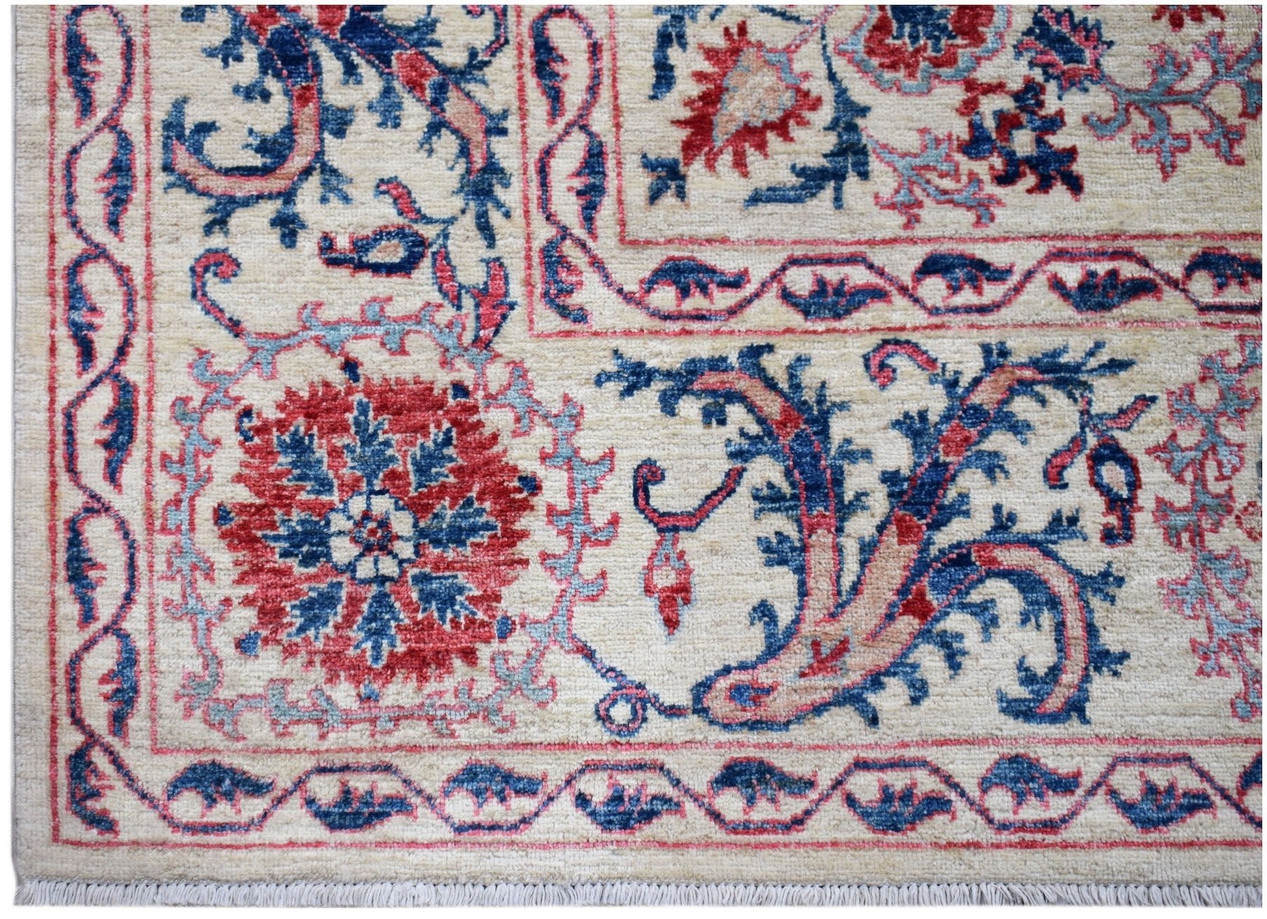 Handwoven Afghan Chobi rug featuring traditional Suzani floral motifs in red and blue on cream.