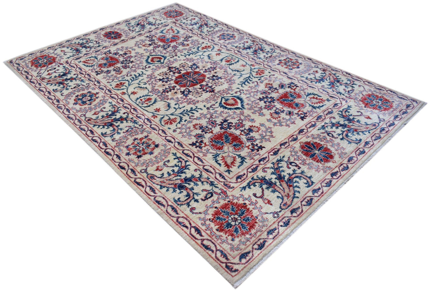 Handmade Afghan Chobi rug featuring a traditional Suzani floral pattern in red and blue on cream.