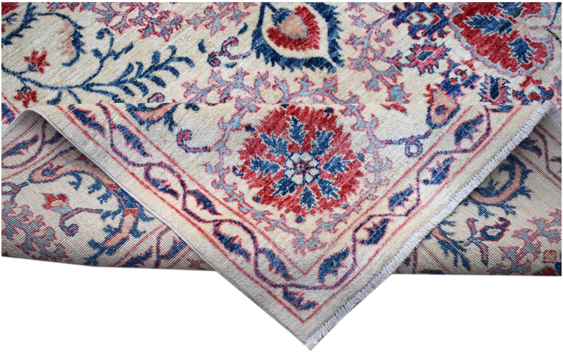 A handmade Afghan Chobi rug featuring a traditional Suzani floral pattern in red and blue tones.