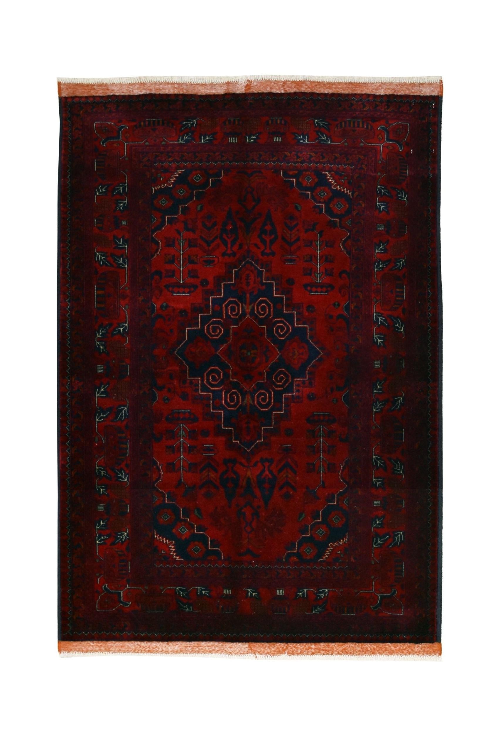 Handmade Afghan Biljik wool rug featuring a deep red field with blue geometric patterns.