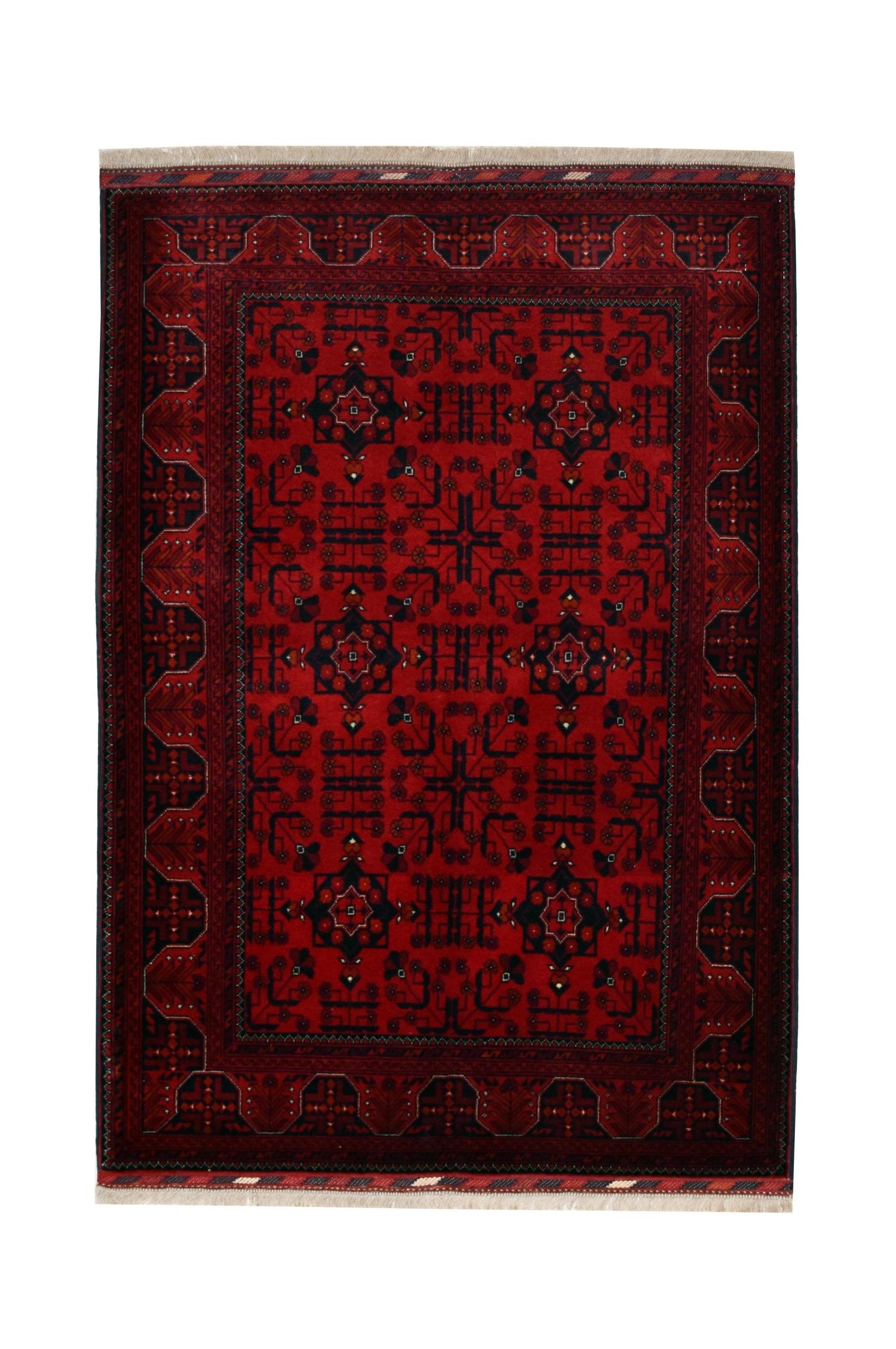 A handmade Afghan Biljik rug featuring intricate geometric patterns in deep red and blue wool.