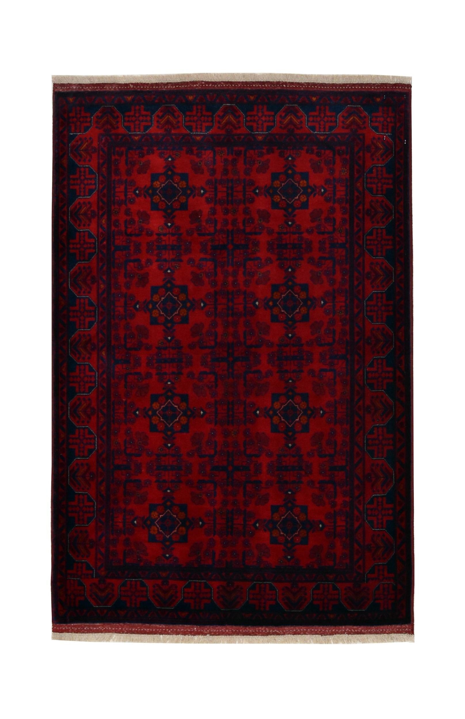 Handmade Afghan Biljik rug featuring a deep red field with intricate blue geometric patterns.