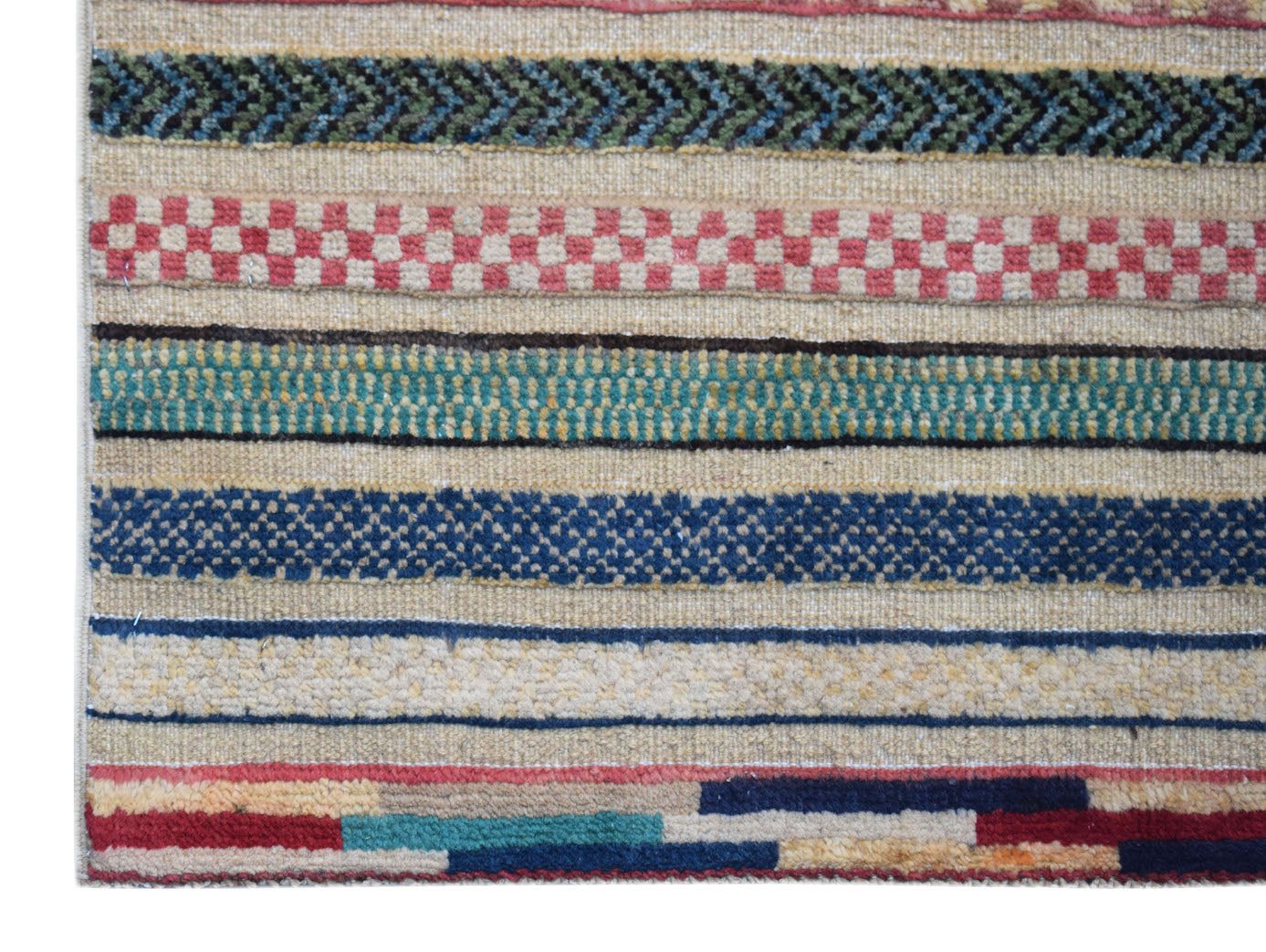 A handmade Afghan runner featuring horizontal bands of geometric patterns in vibrant colors.