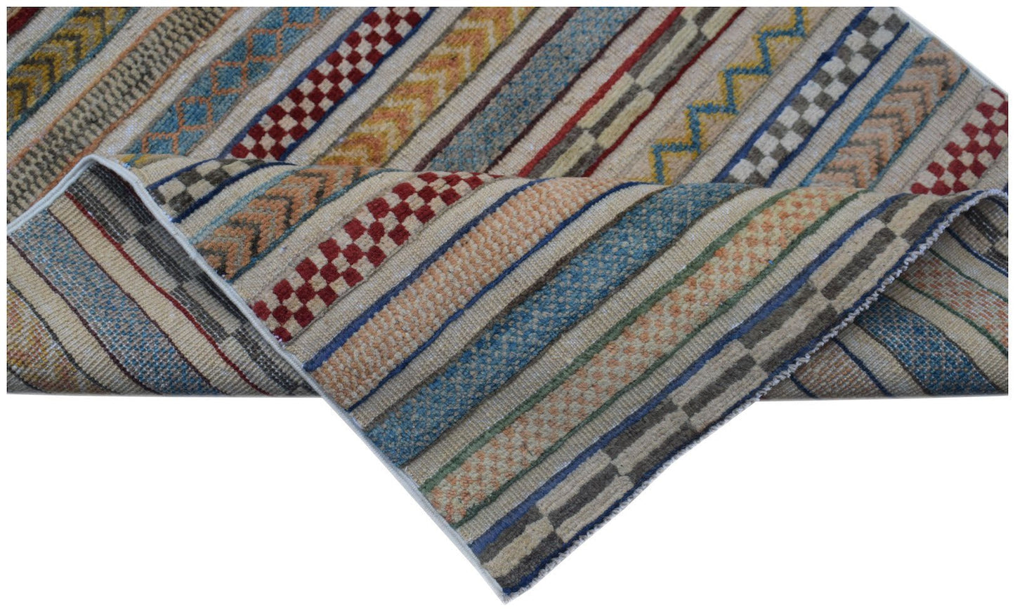 Handmade Afghan Yekta runner featuring a striped pattern with varied textures and earthy colors.