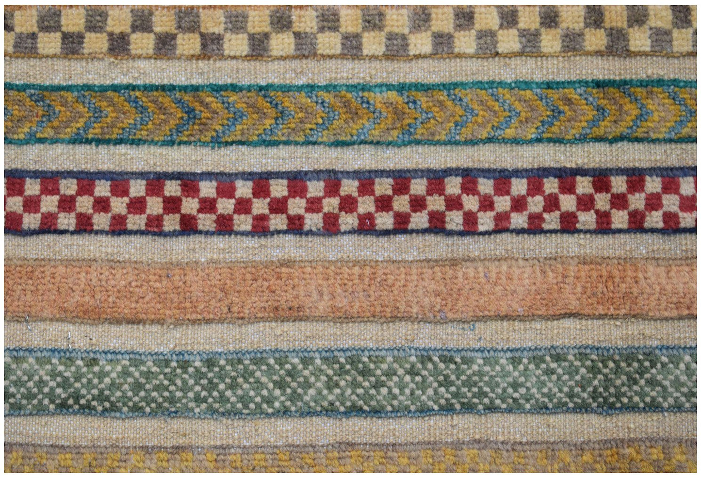 A handmade Afghan runner featuring horizontal bands of geometric patterns in varied colors.