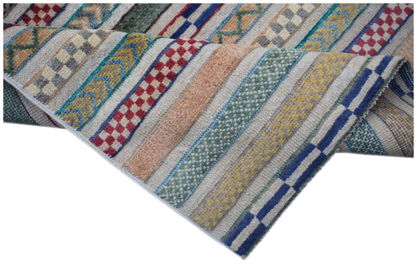 Handmade Afghan runner rug featuring a textured striped pattern in vibrant, multi-colored wool.