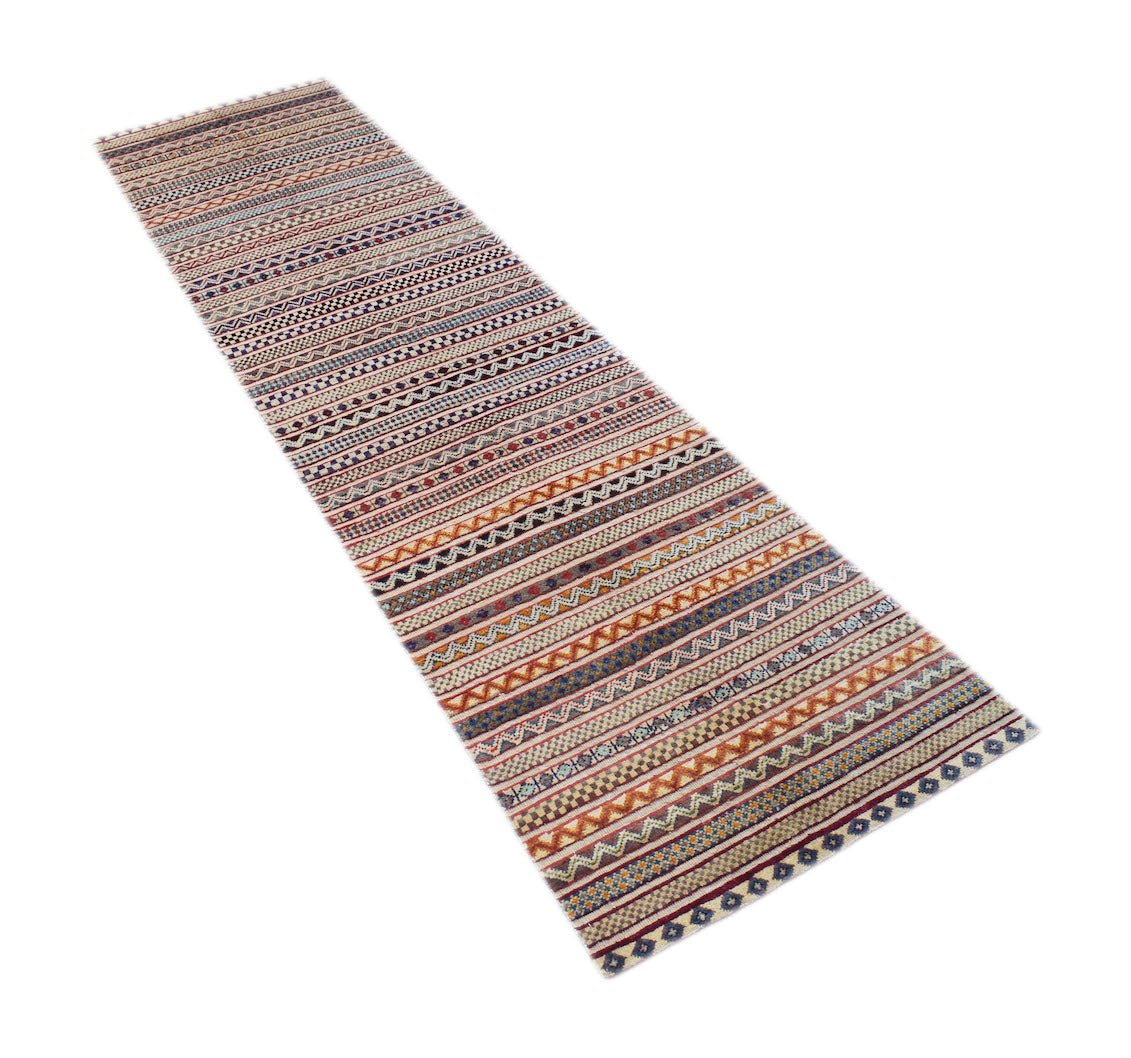 An Afghan Yekta runner rug featuring a long, narrow design with colorful geometric striped patterns.