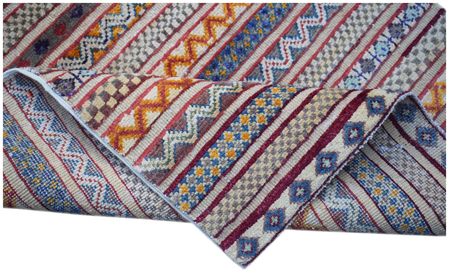An Afghan Yekta runner featuring a vibrant, multi-patterned striped design in wool.