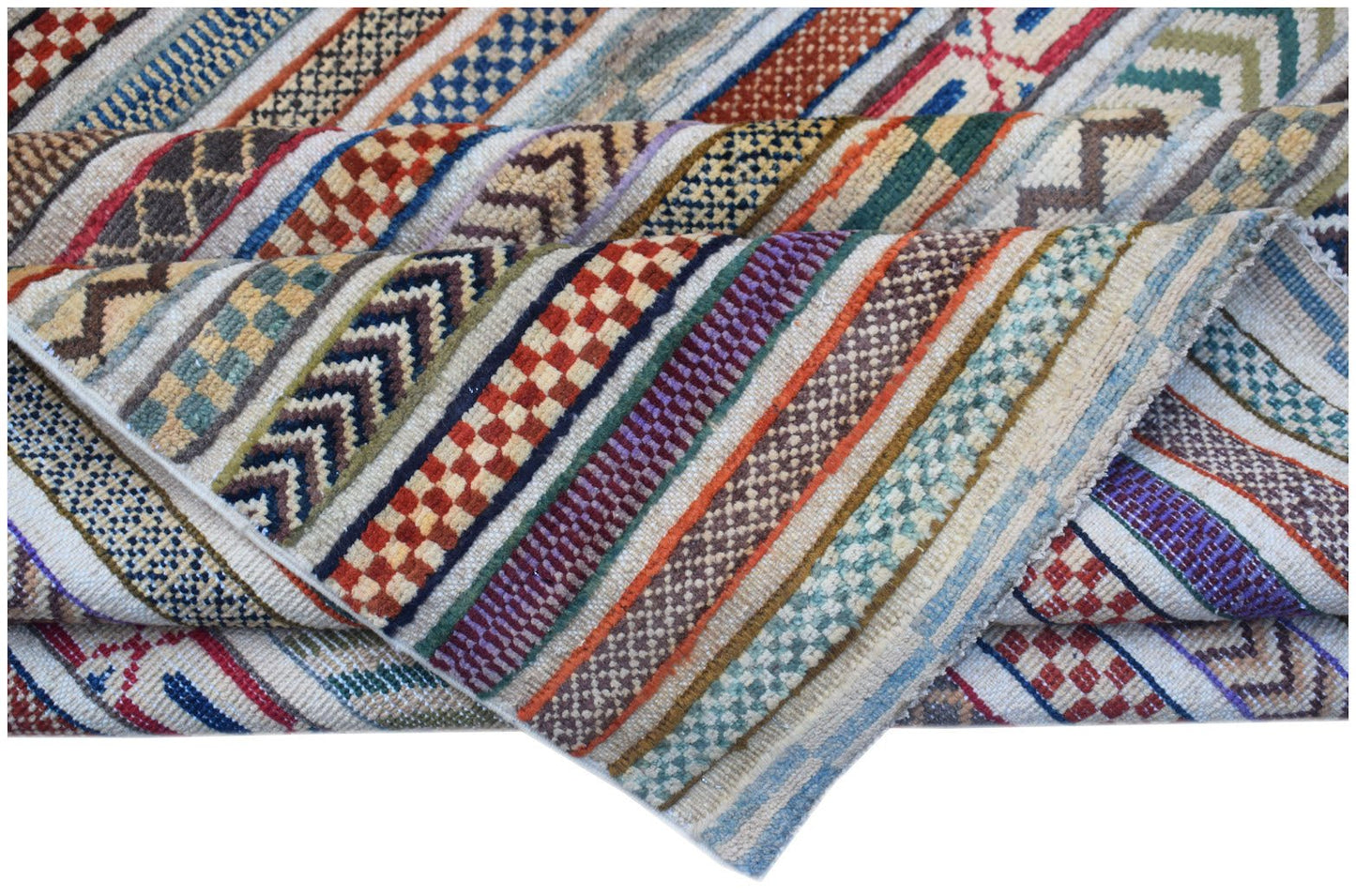 Handmade Afghan Yekta rug featuring a textured, multi-colored striped pattern.