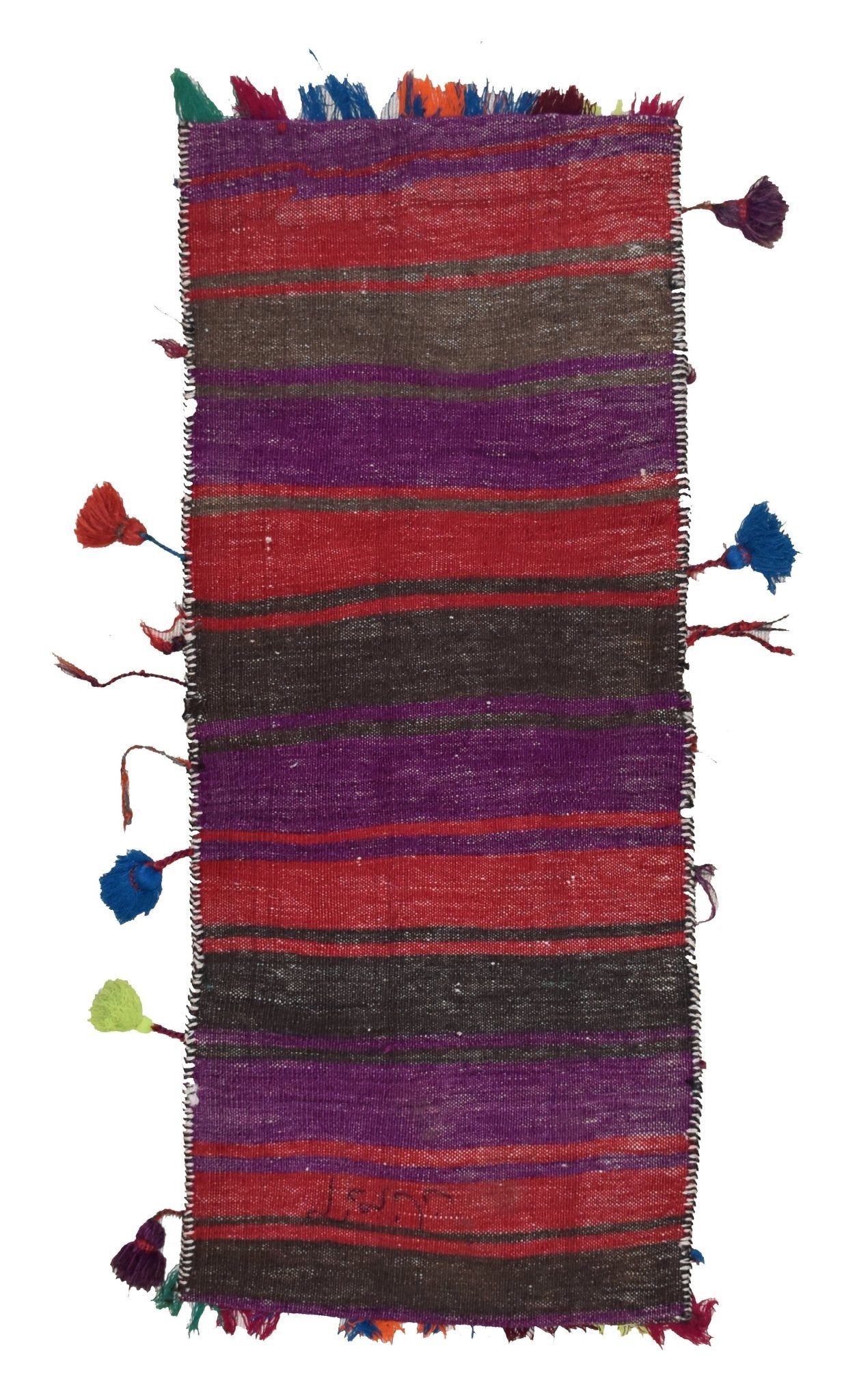 A vintage handmade Afghan wool saddle bag featuring colorful horizontal stripes and side tassels.
