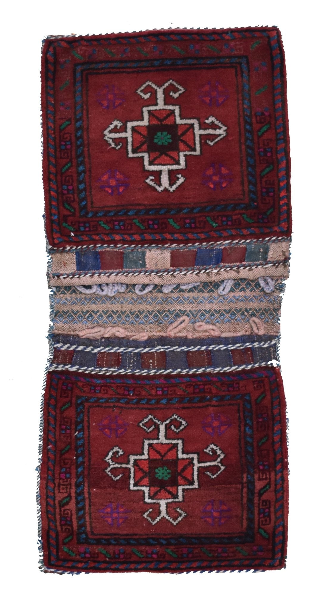 A vintage handmade Afghan wool saddle bag featuring two matching red panels with geometric motifs.