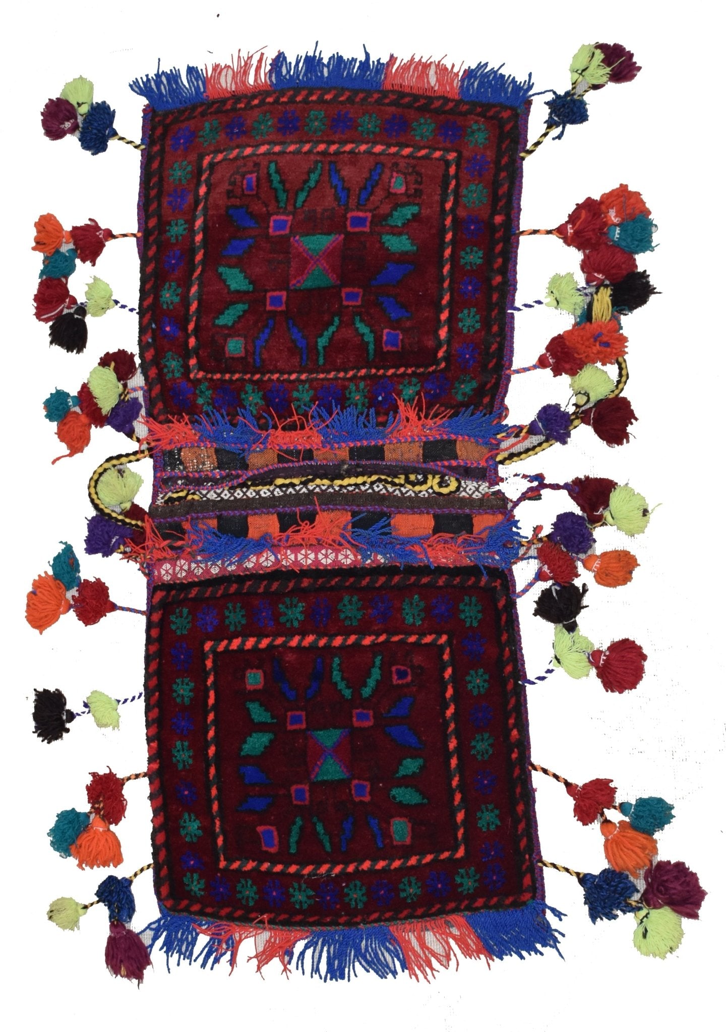 A handmade vintage Afghan wool saddle bag featuring two square panels with colorful tribal motifs.