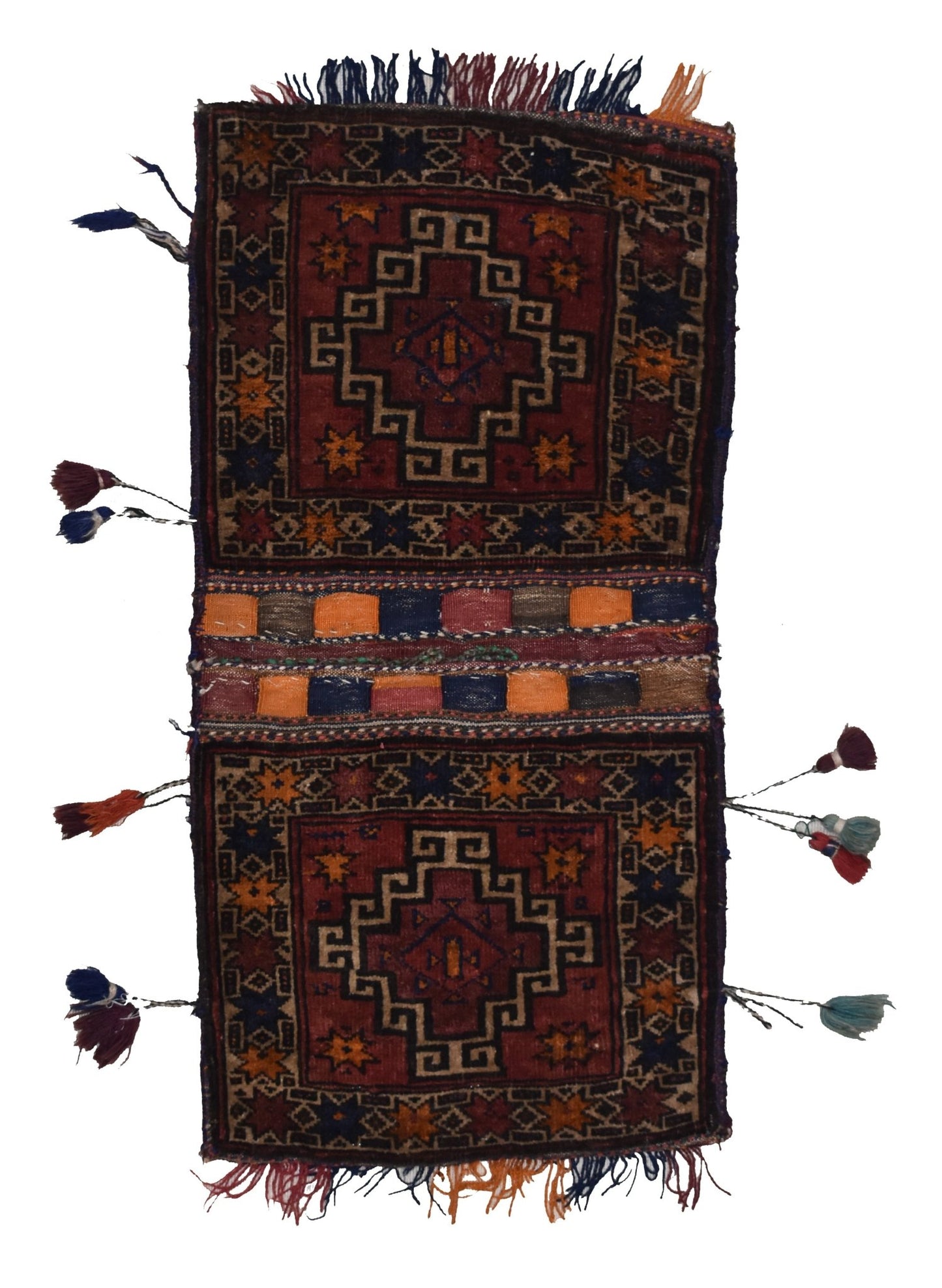 A vintage handmade Afghan wool saddle bag featuring geometric patterns and decorative tassels.