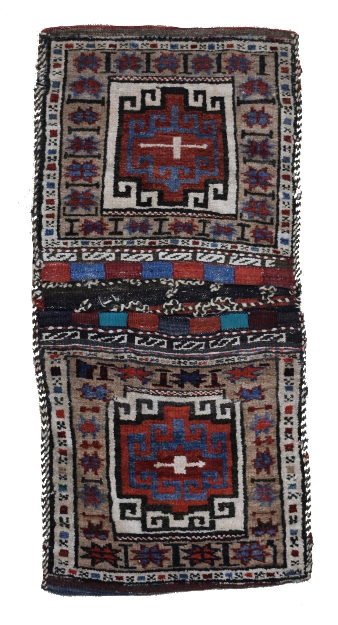 A handmade vintage Afghan wool saddle bag featuring two matching geometric tribal patterns.