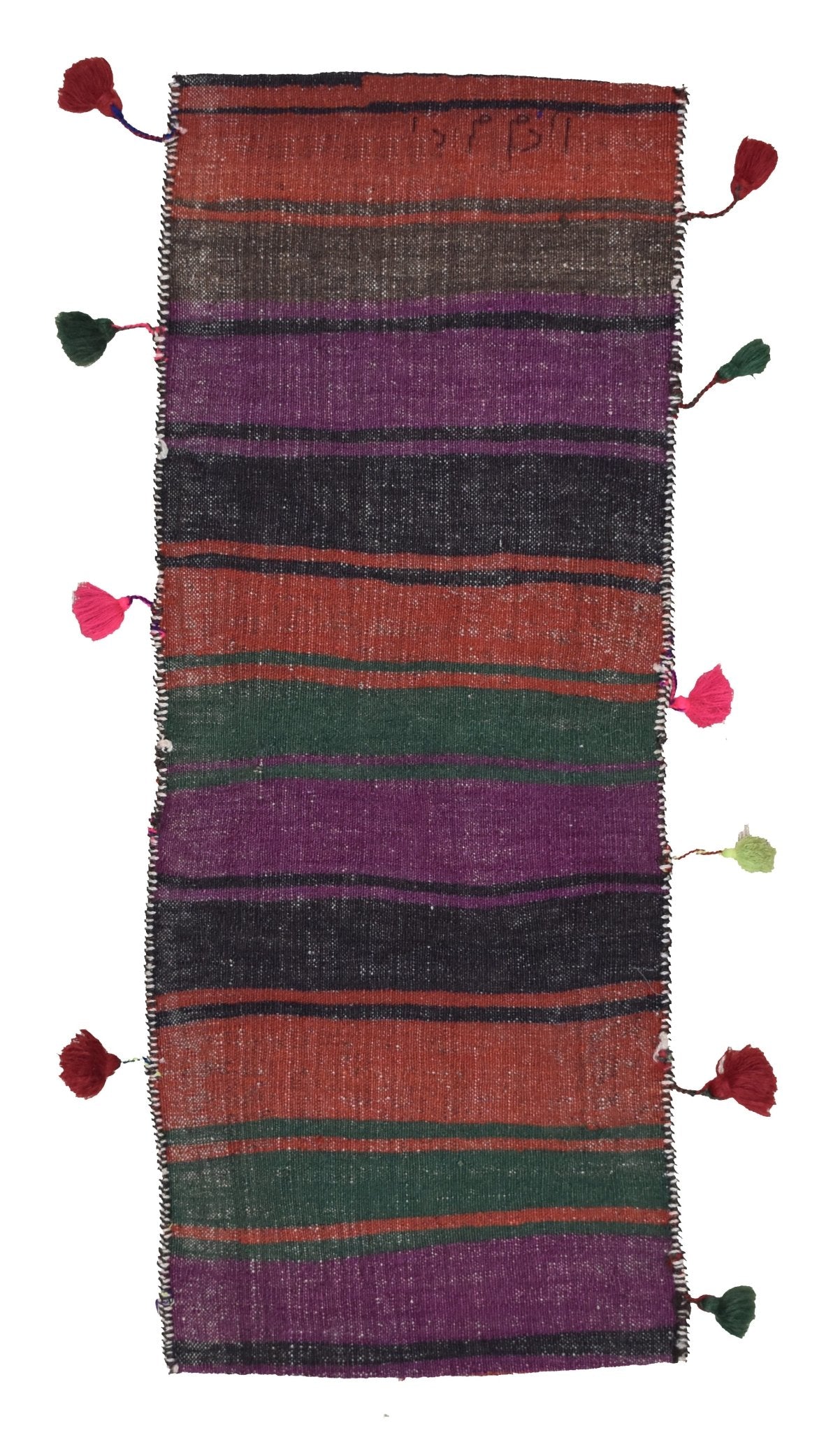 A vintage handmade Afghan wool saddle bag featuring colorful horizontal stripes and side tassels.