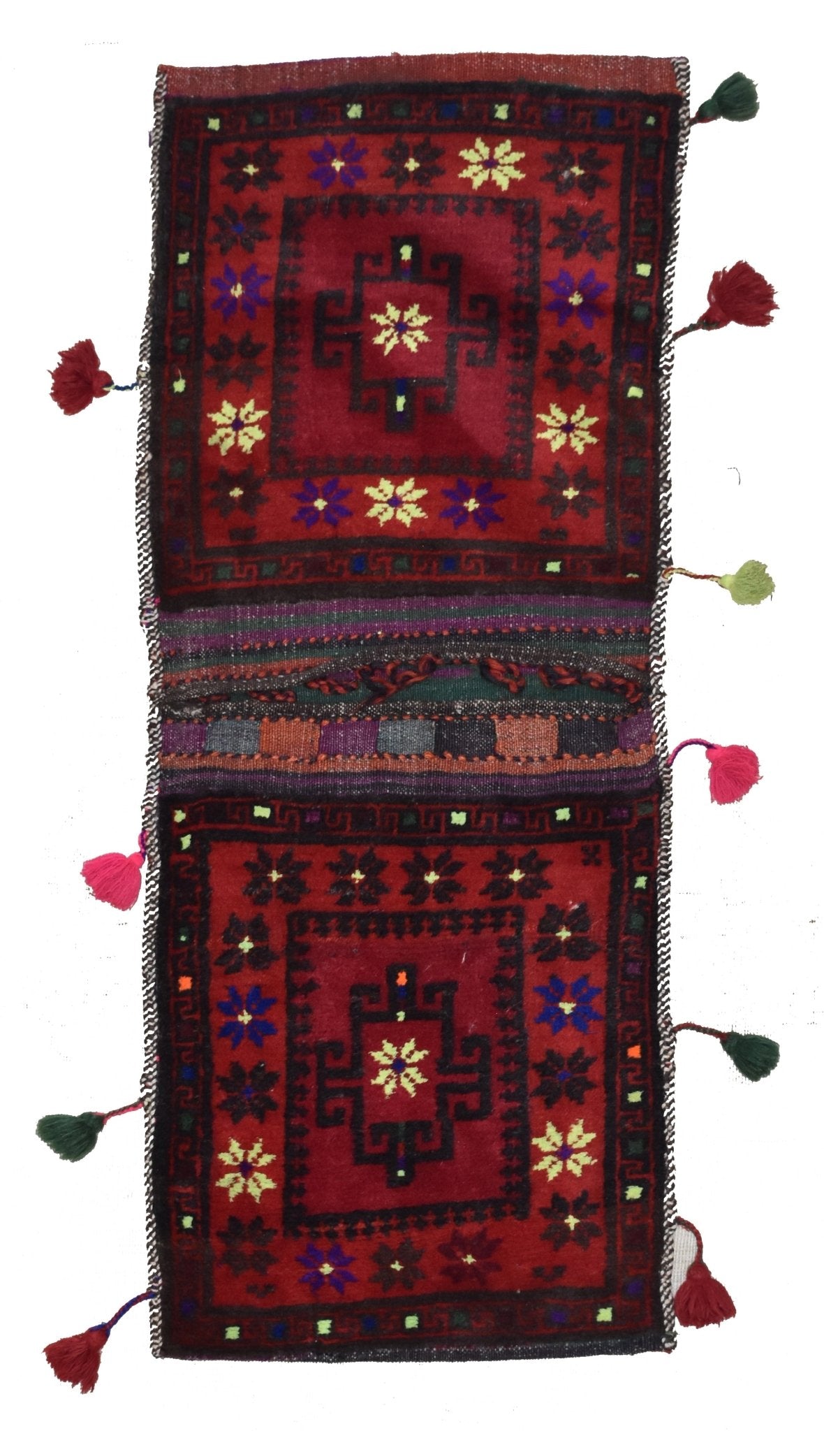 A handmade vintage Afghan wool saddle bag featuring red panels with geometric floral patterns.