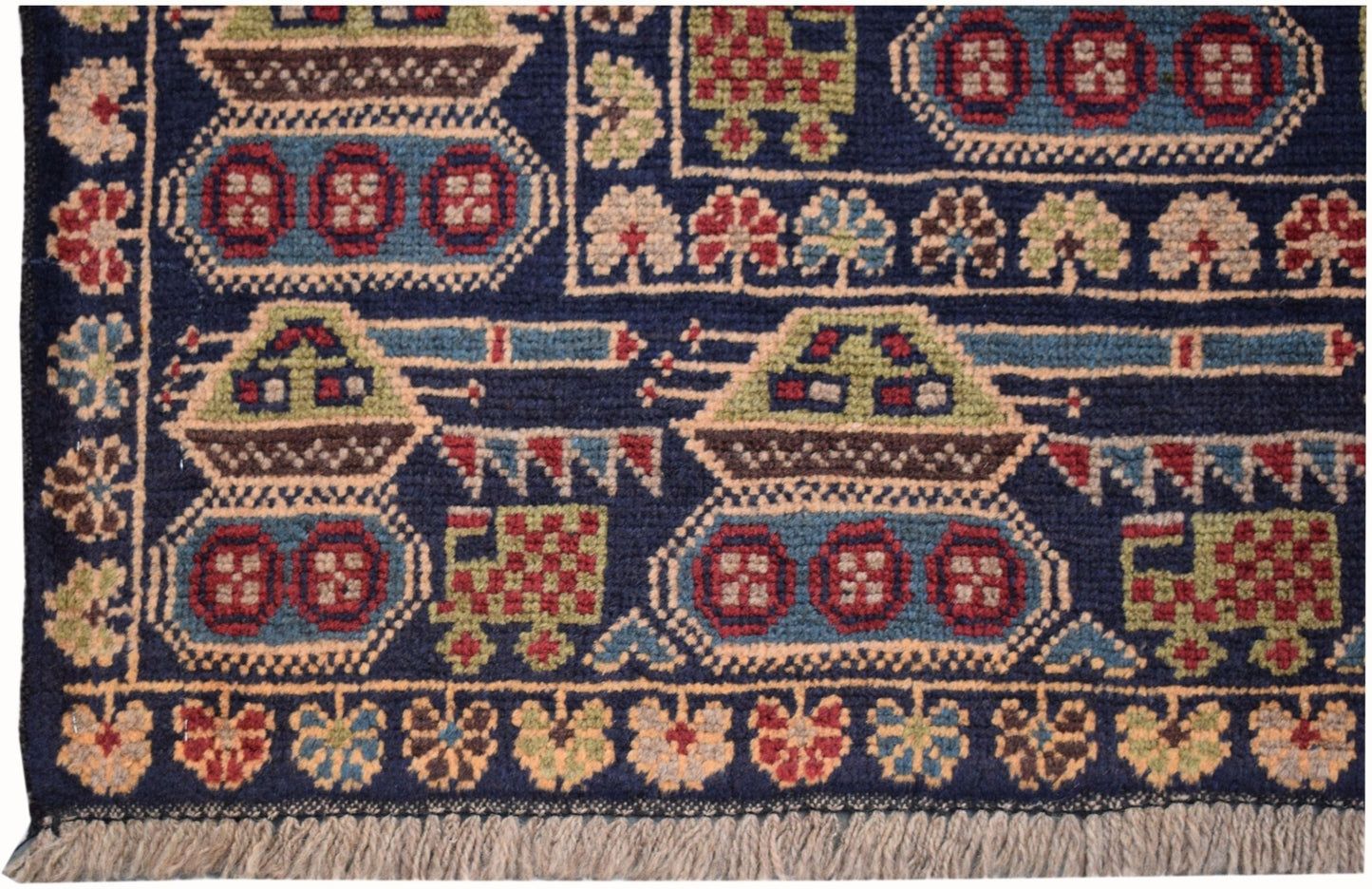 Handmade Afghan wool rug featuring a dark blue field with repeating tank and floral motifs.