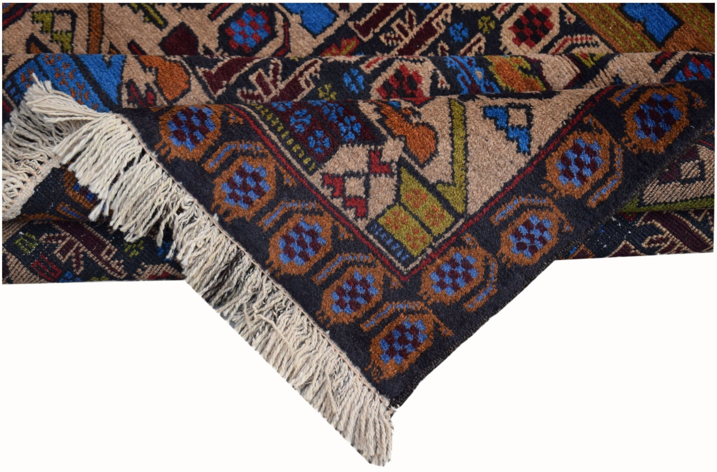 A handmade Afghan wool rug featuring geometric patterns in blue, red, and green on a dark ground.