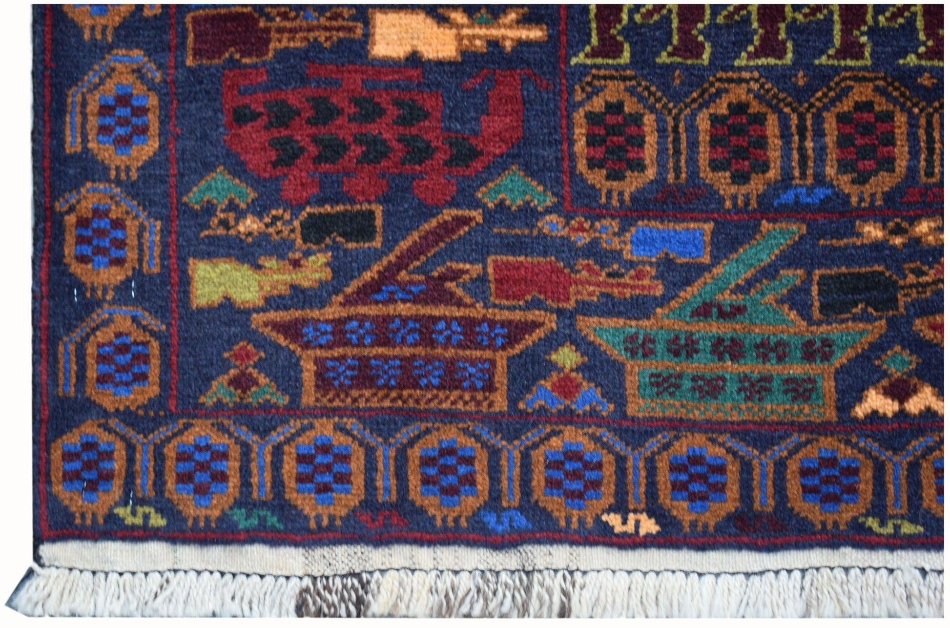 A handmade Afghan wool rug featuring traditional geometric patterns and stylized war motifs.