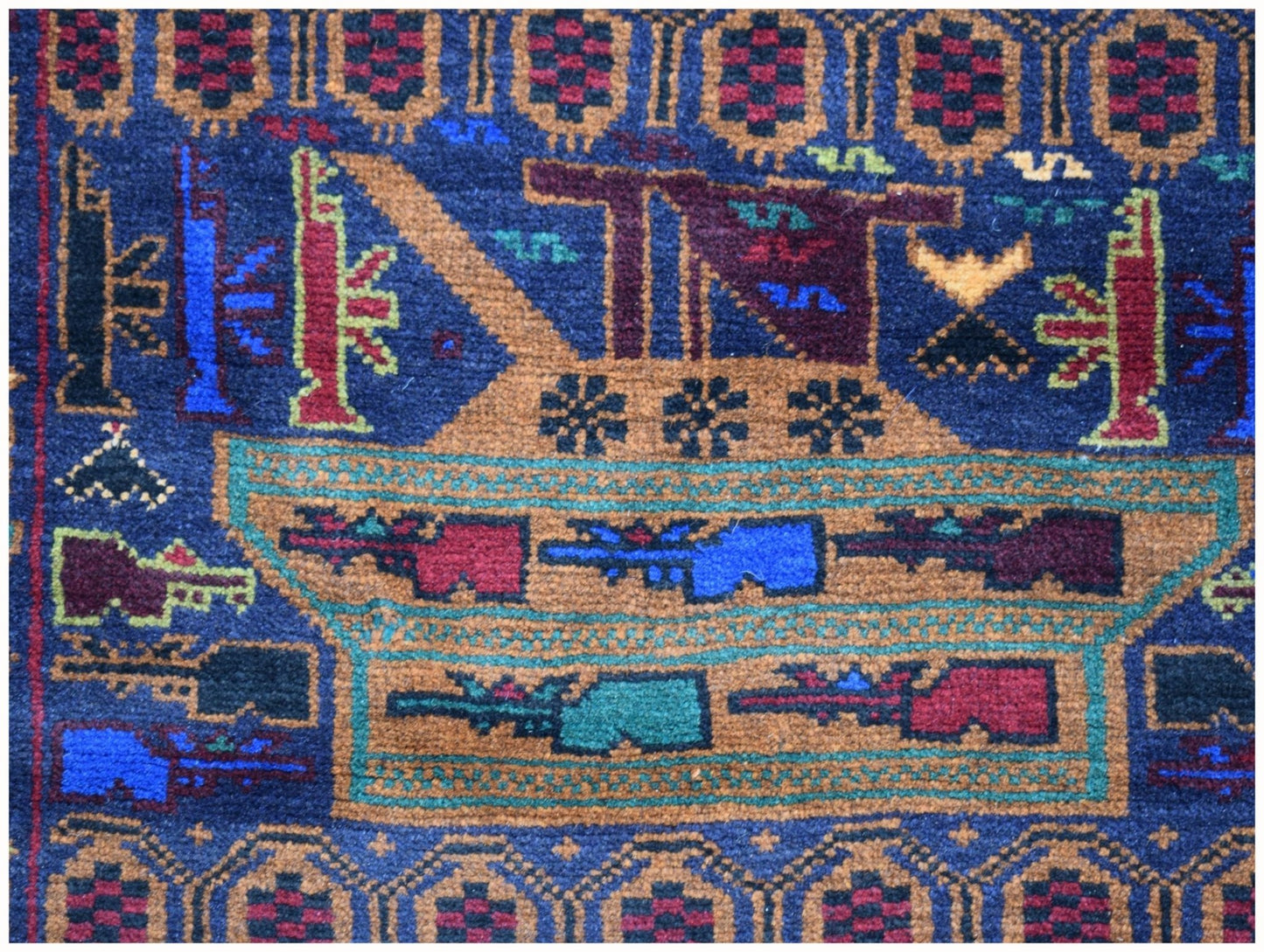 Handmade Afghan wool rug featuring a geometric war-themed motif in blue, red, and tan tones.