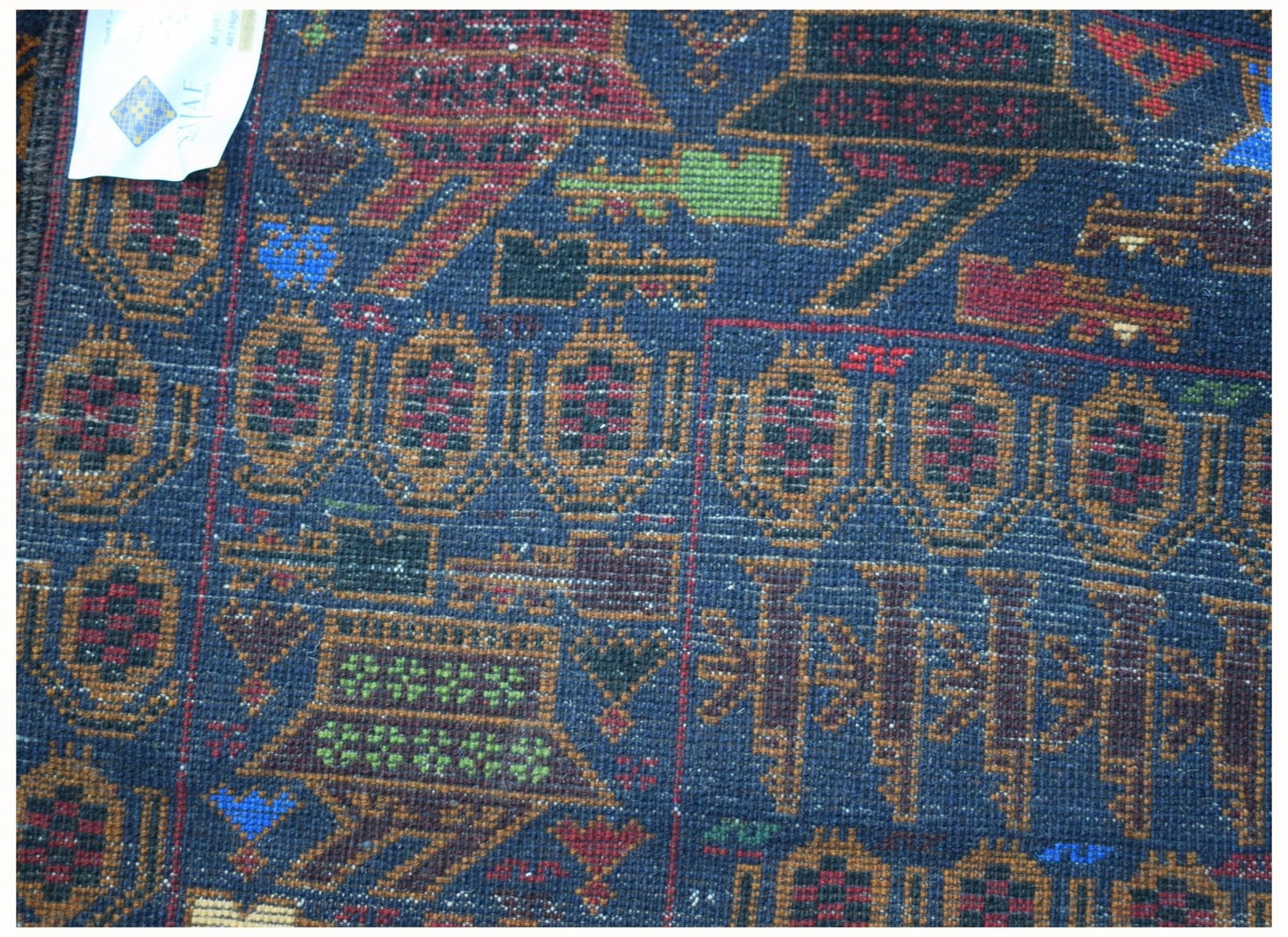 Handmade Afghan wool rug featuring intricate geometric patterns and traditional war motifs.