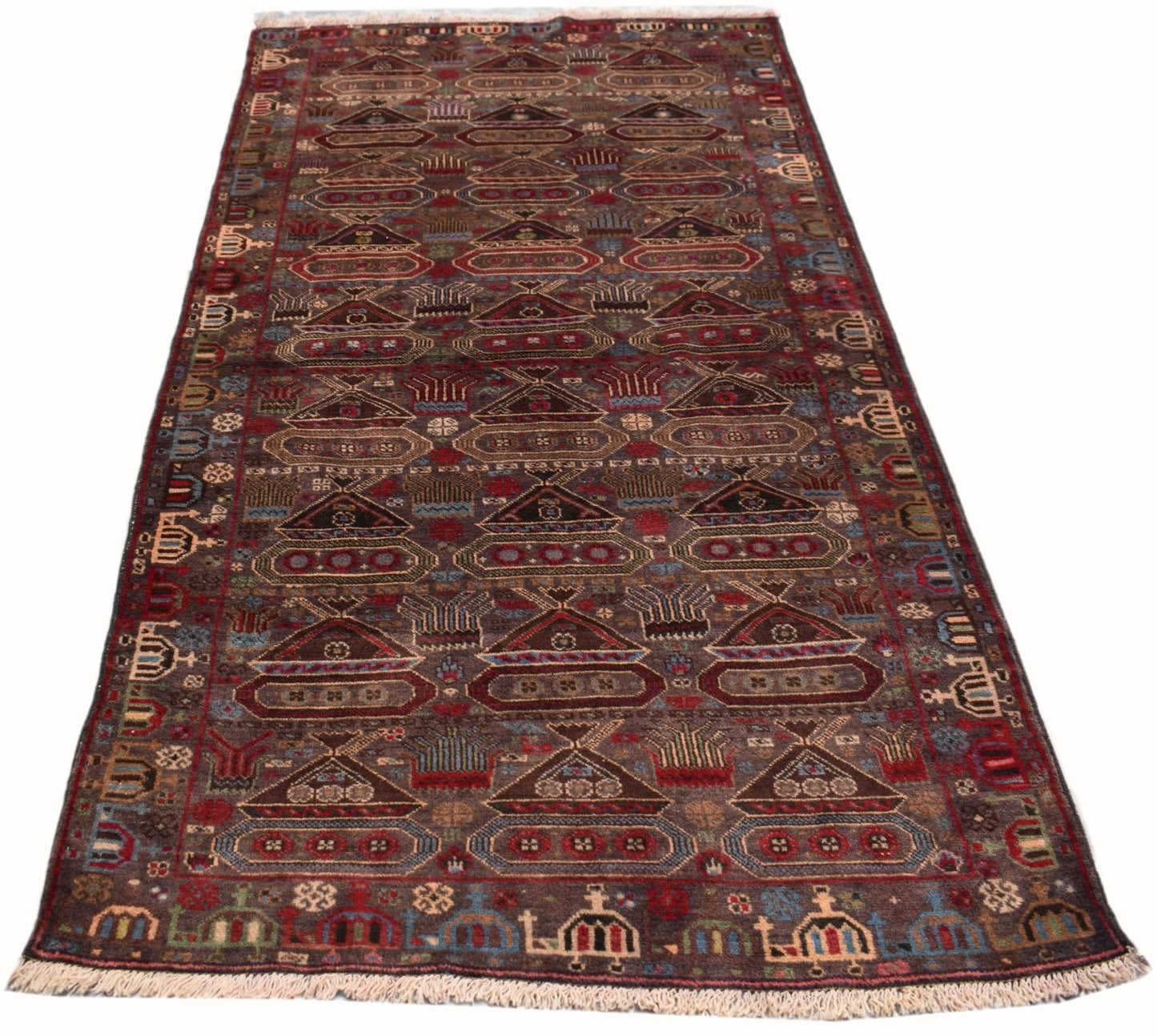 Handmade Afghan Pashm wool runner rug featuring a dark brown field with geometric war motifs.