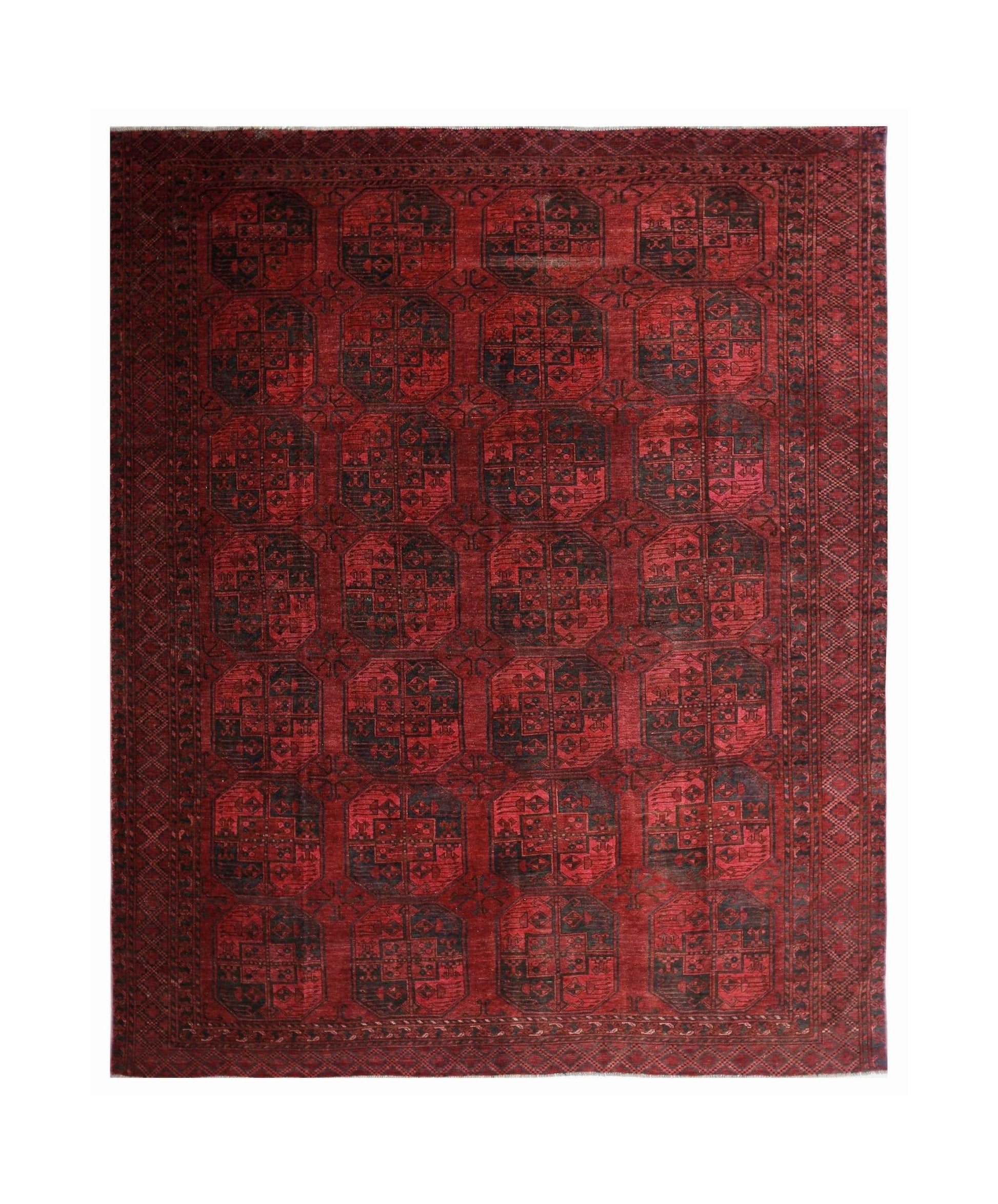 An antique Afghan Turkmen rug featuring repeating dark elephant foot motifs on a vibrant red field.