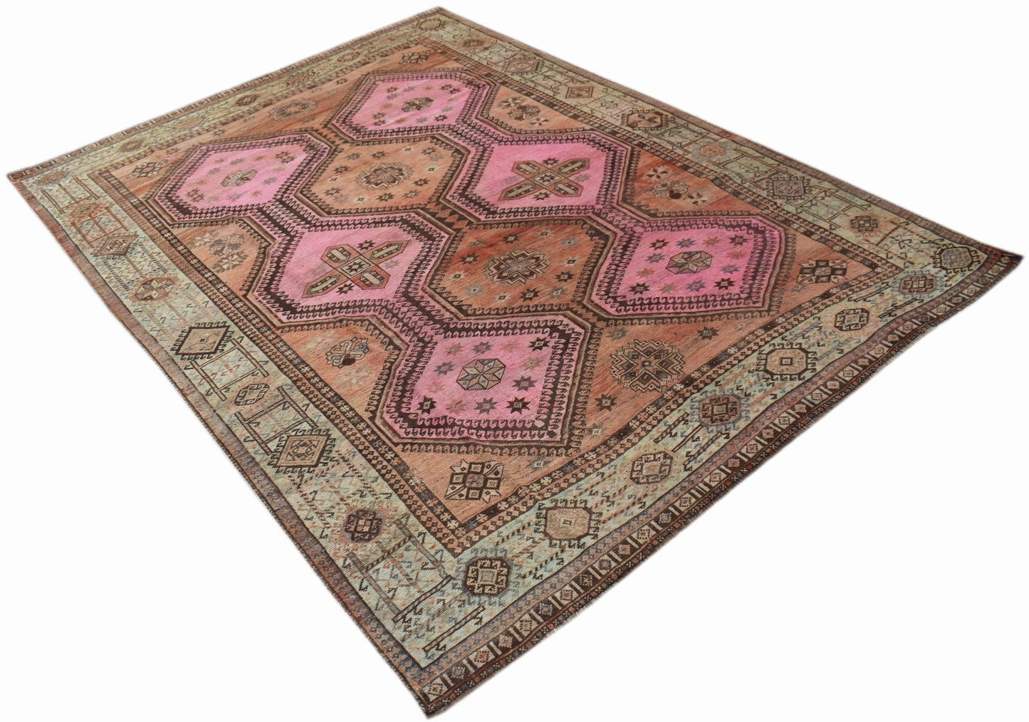 A vintage Persian Hamadan rug featuring a geometric pattern in shades of pink, brown, and green.