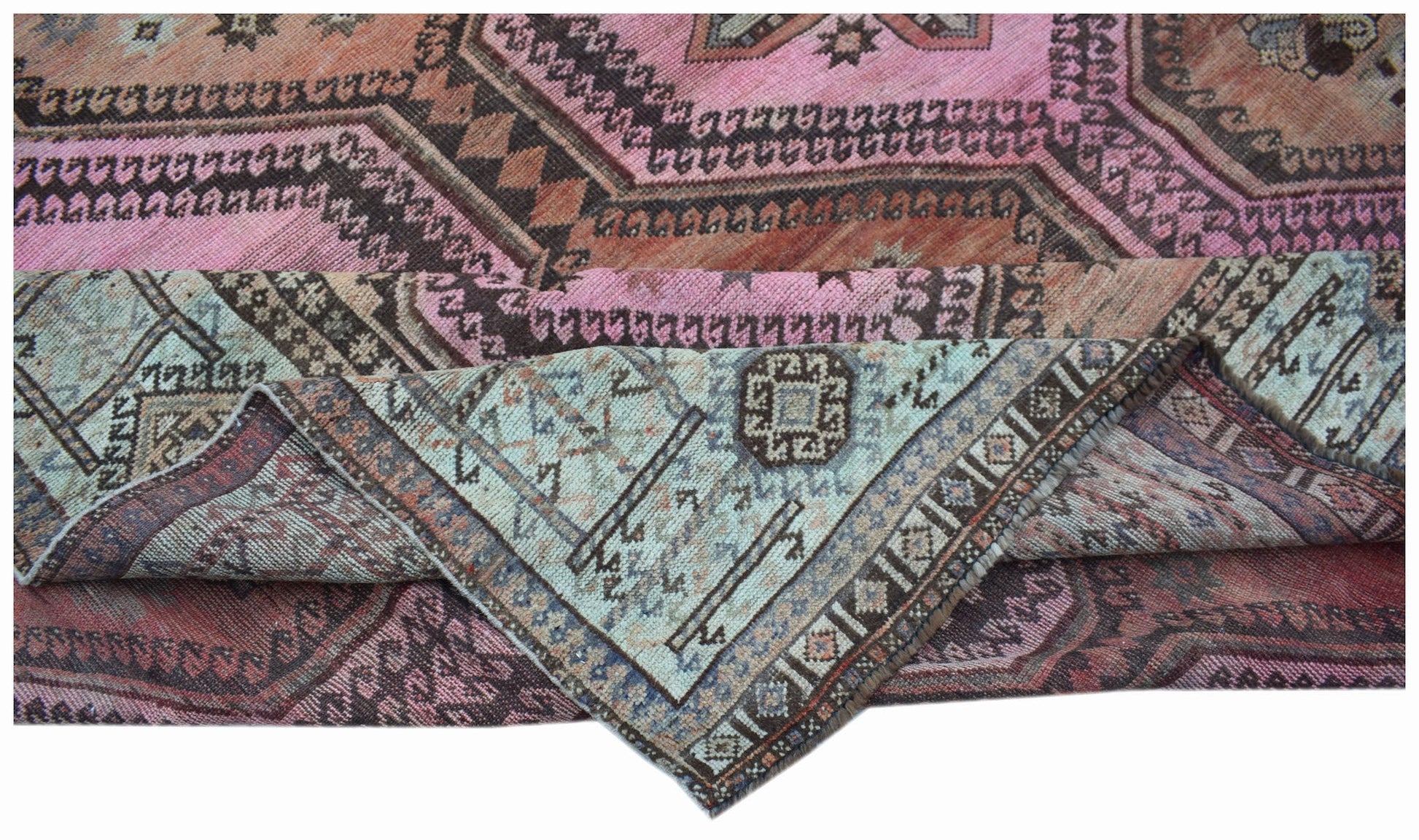 A vintage handwoven Persian Hamadan rug featuring a geometric pattern in pink and blue tones.