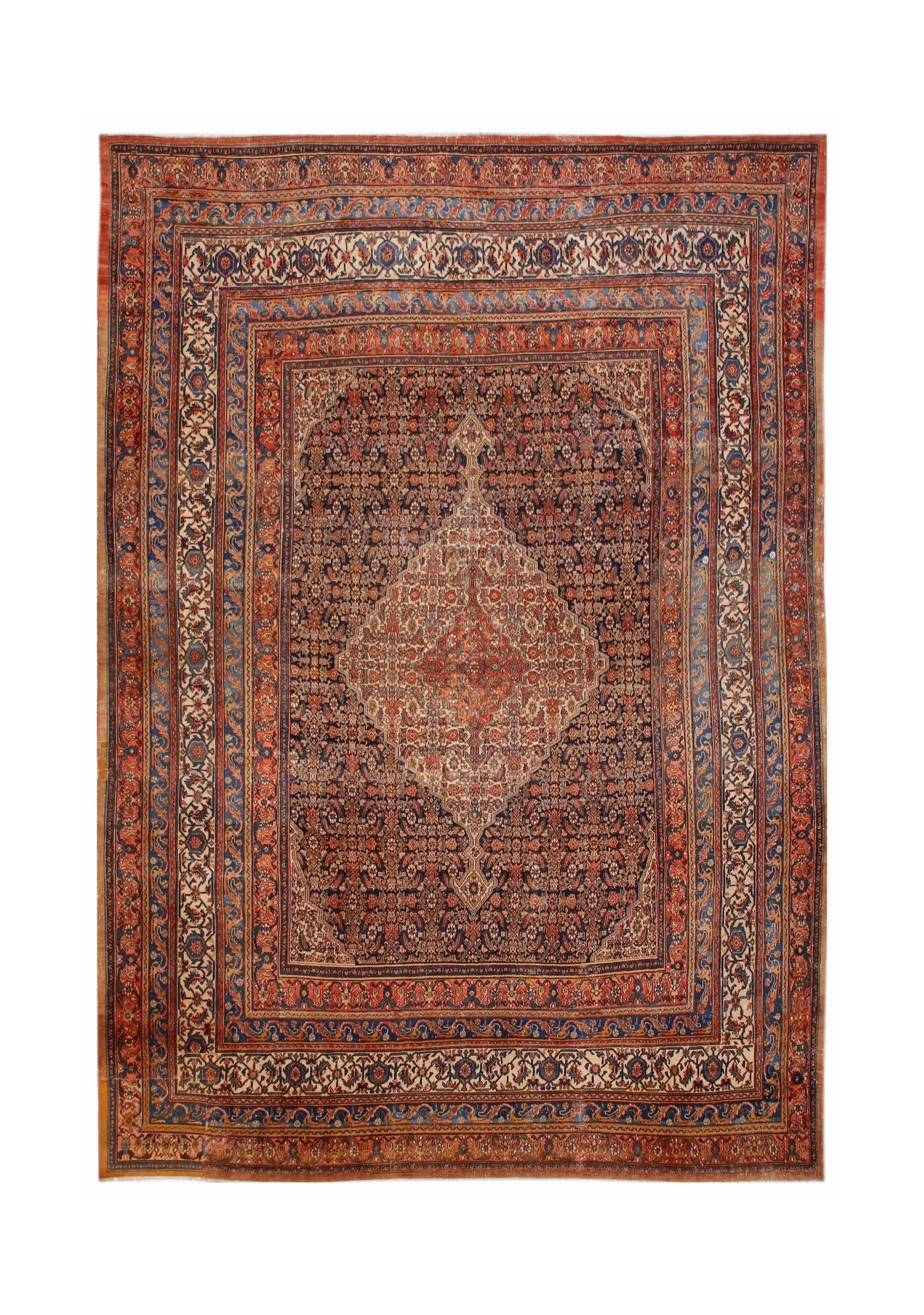 An antique Persian Senneh rug featuring a central cream medallion on a dark floral field.