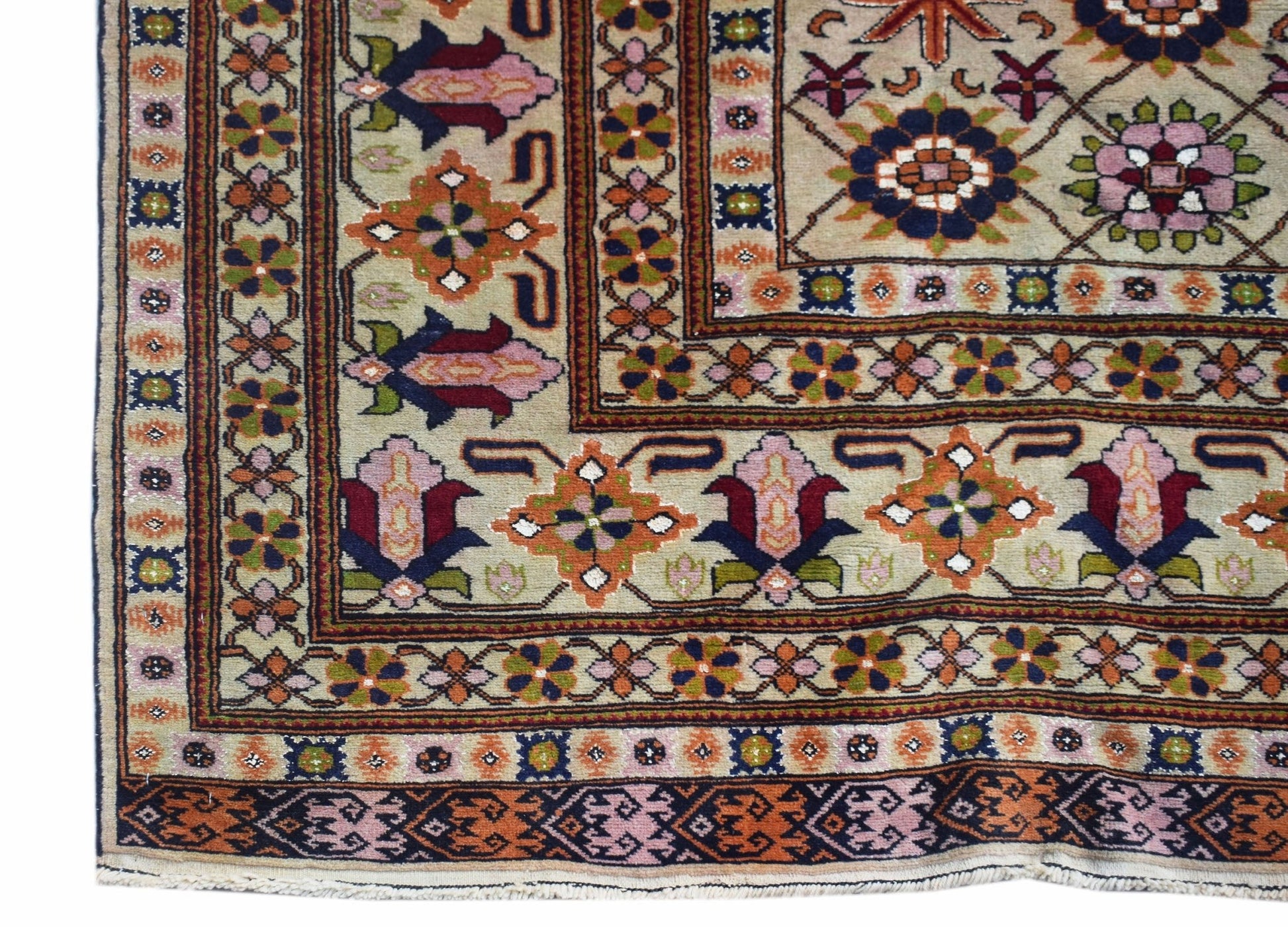 A hand-knotted Afghan Bashiri rug featuring intricate geometric floral patterns in silk and wool.