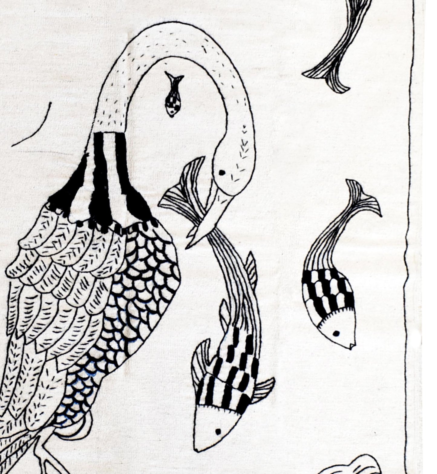 A handmade Afghan kilim featuring black embroidered line art of a large bird and several fish.