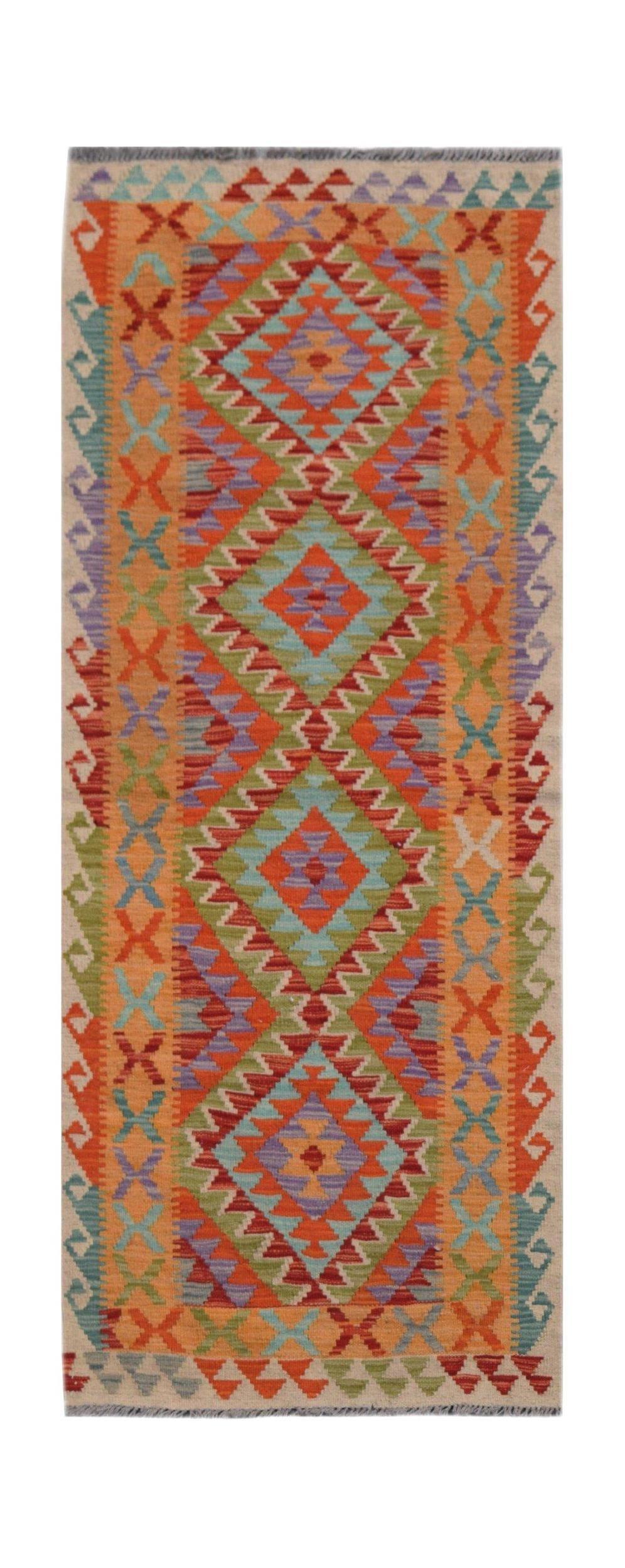 Handmade Afghan Maimana wool runner rug featuring a colorful geometric diamond pattern.