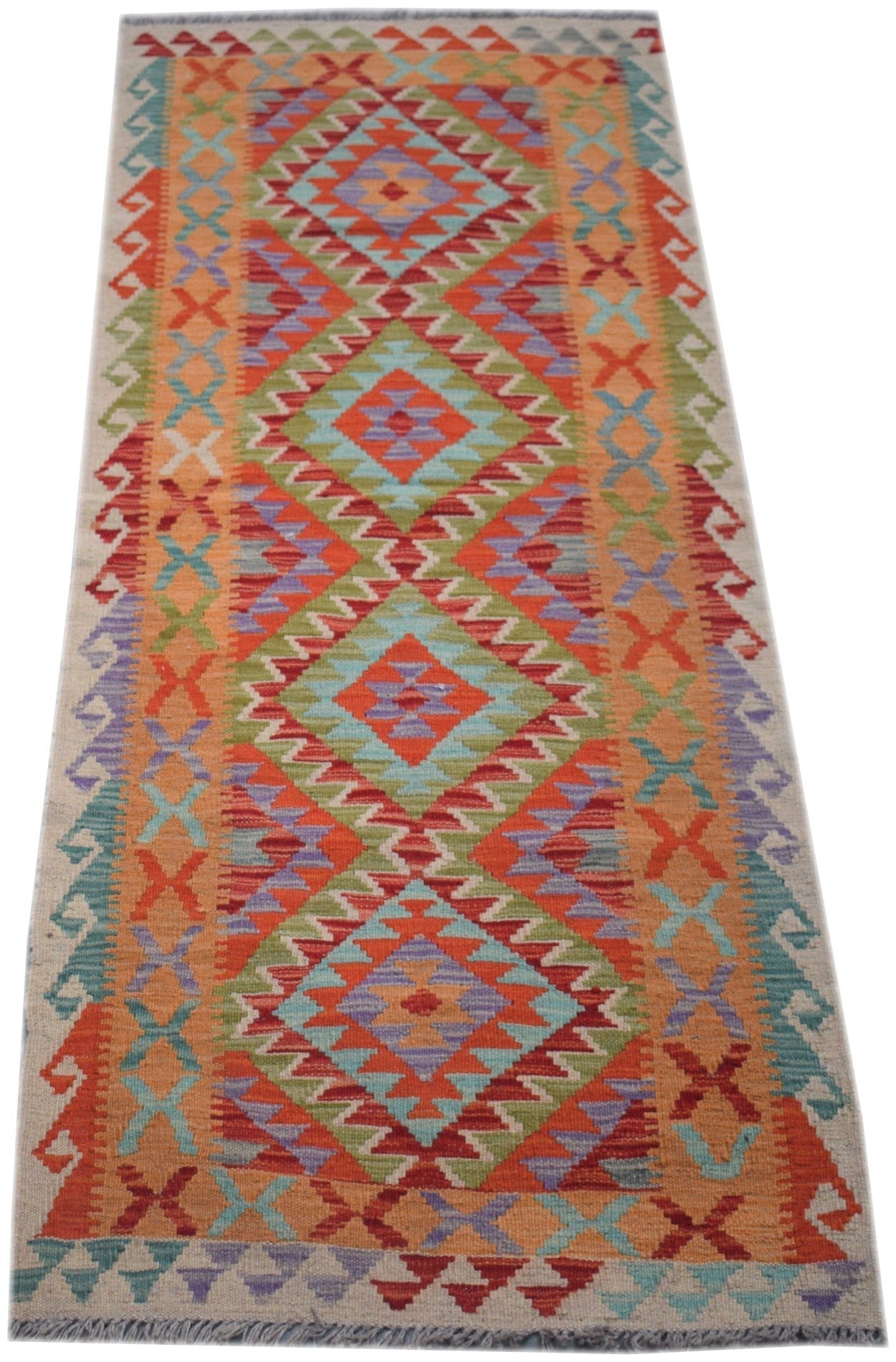 Handmade Afghan Maimana wool runner rug featuring a colorful geometric diamond pattern.