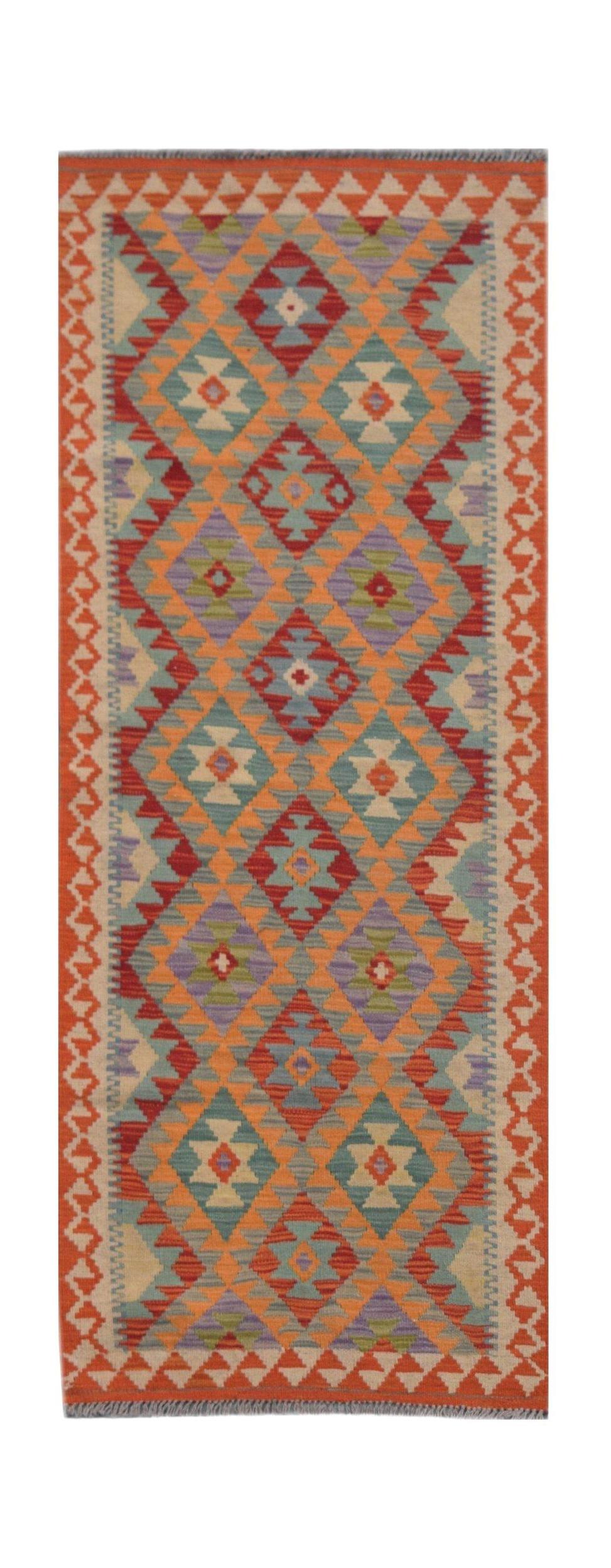 Handmade Afghan Maimana wool runner rug featuring a colorful geometric diamond pattern.
