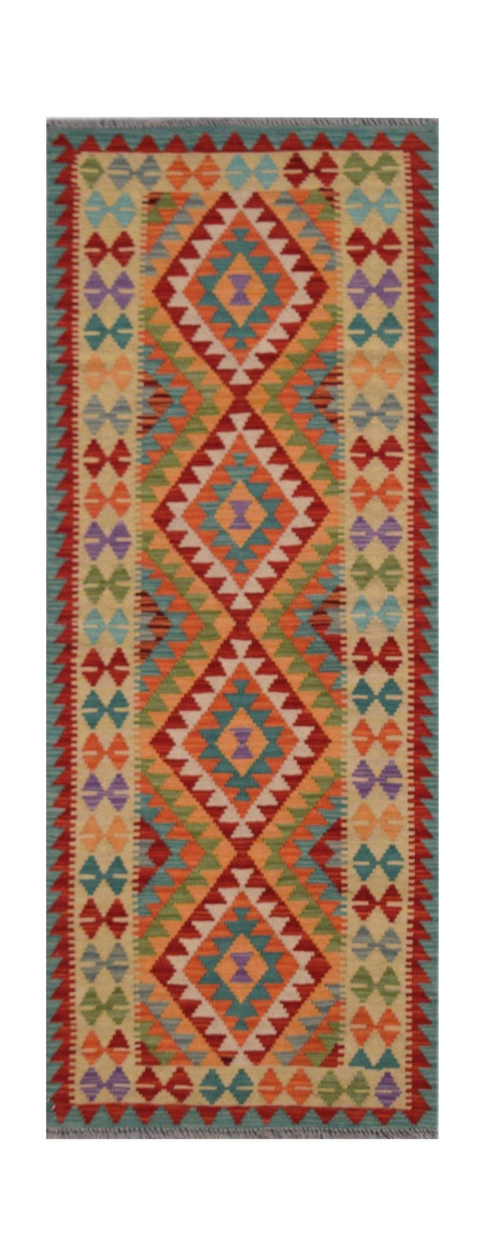 Handmade Afghan Maimana wool runner rug featuring a vibrant geometric diamond pattern.