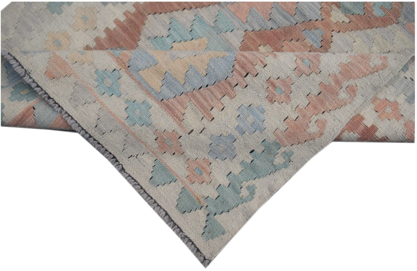A handmade Afghan Maimana kilim runner featuring geometric patterns in soft pastel tones.