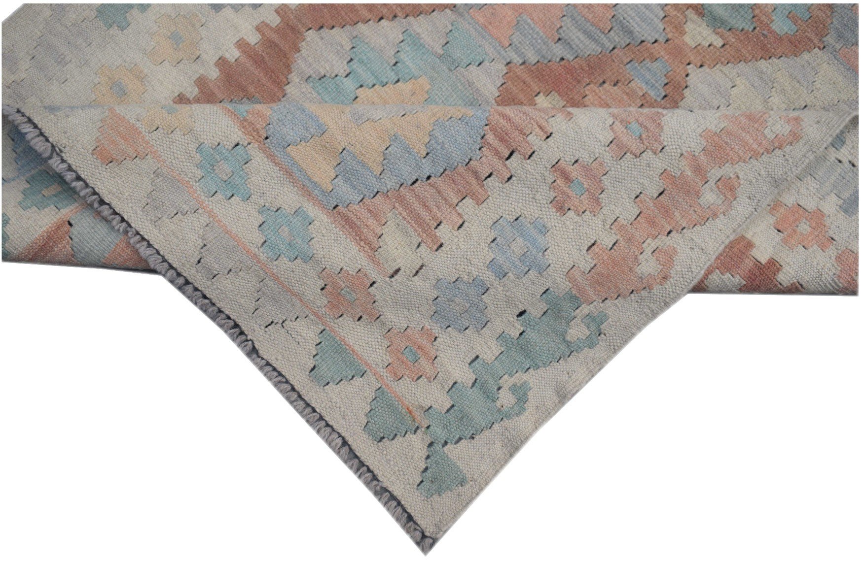 A handmade Afghan Maimana kilim runner featuring geometric patterns in soft pastel tones.