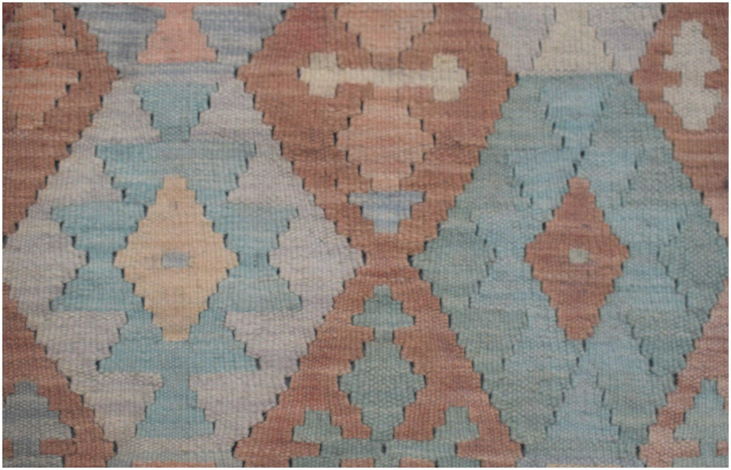Handmade Afghan Maimana kilim runner featuring a geometric diamond pattern in muted earth tones.