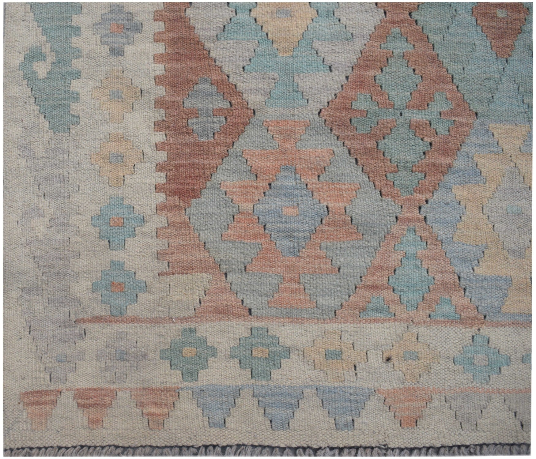 Handmade Afghan Maimana kilim runner featuring a geometric pattern in muted earth tones.