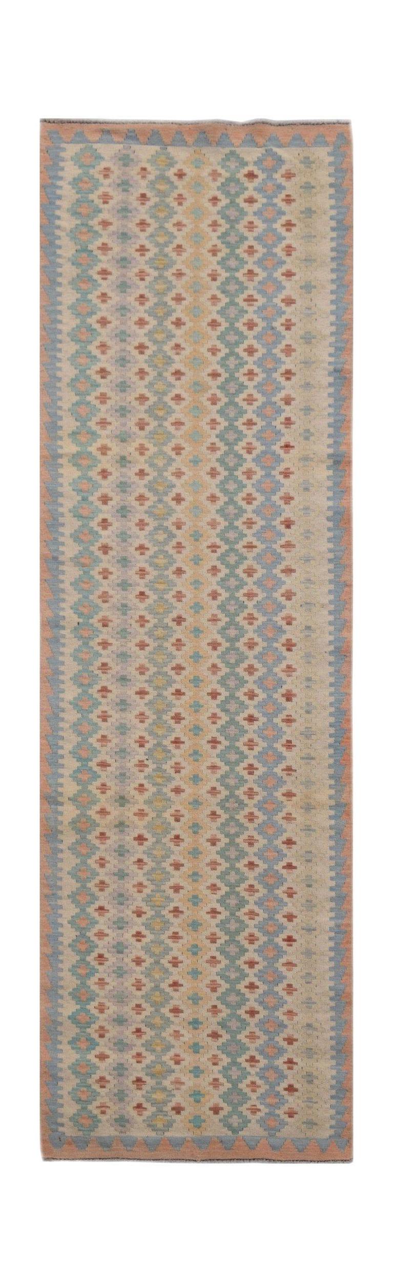 A handmade Afghan Maimana wool runner rug featuring a repeating geometric diamond pattern.