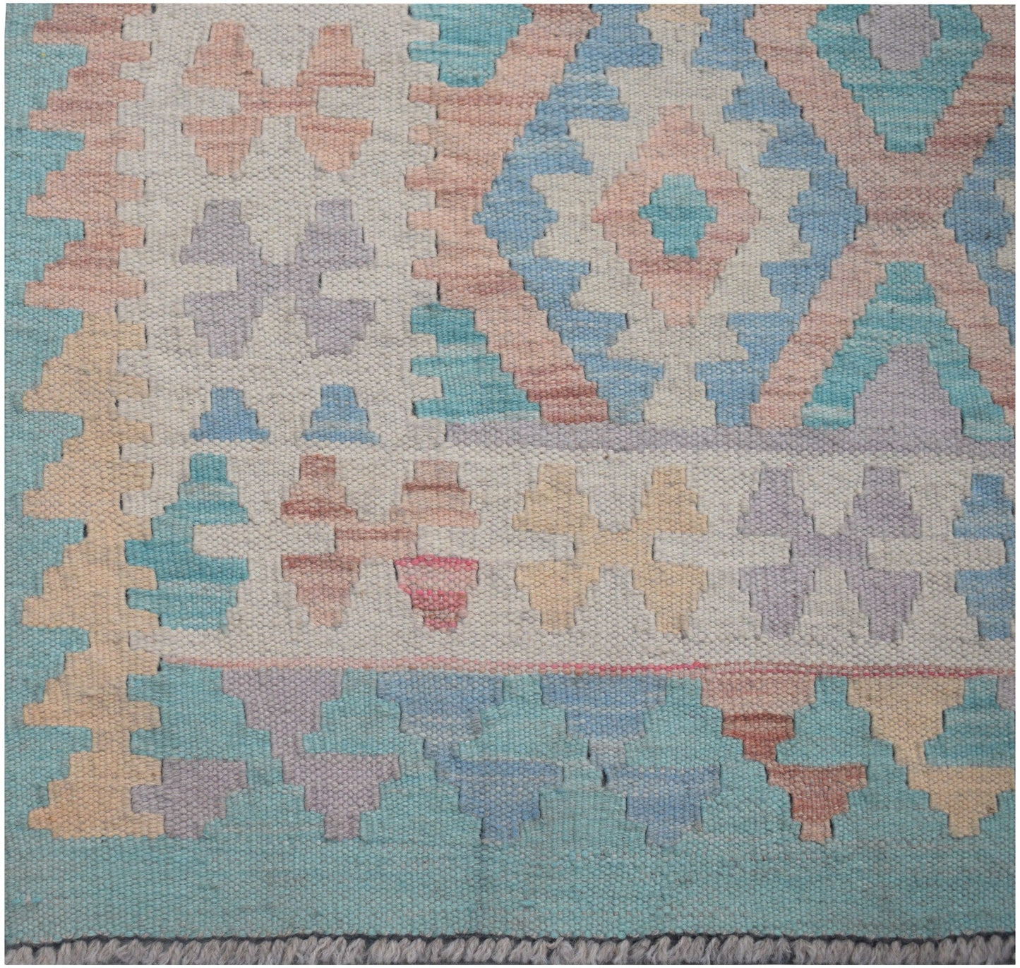 Handmade Afghan Maimana kilim runner featuring a geometric pattern in soft pastel tones.