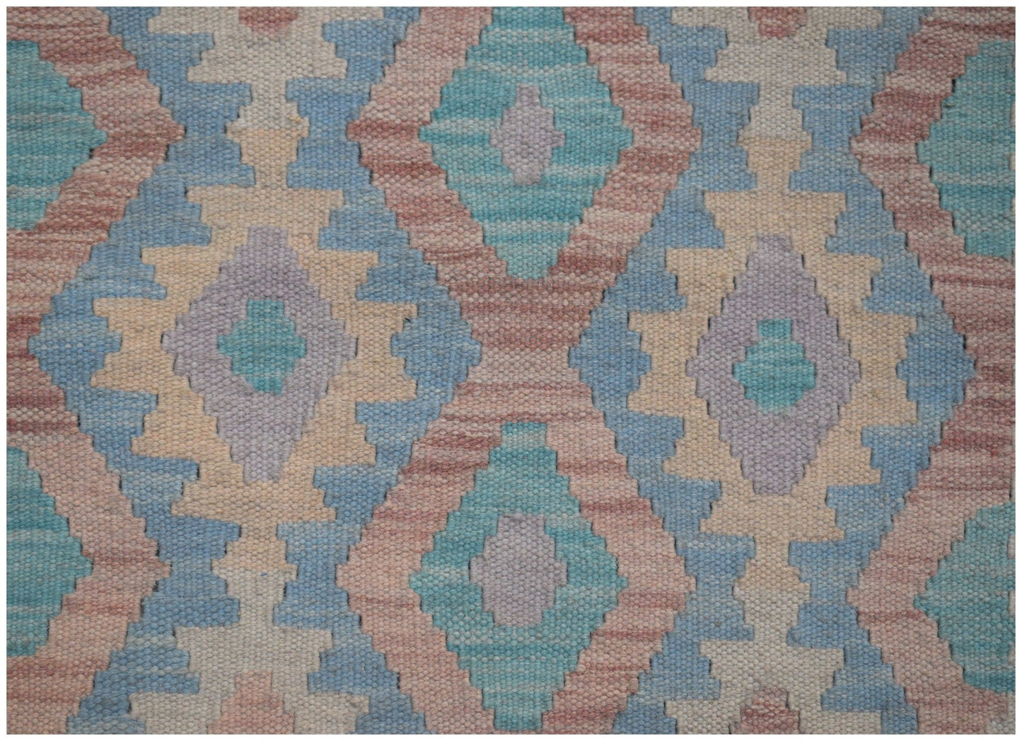 Handwoven Afghan Maimana kilim runner featuring a geometric diamond pattern in pastel tones.