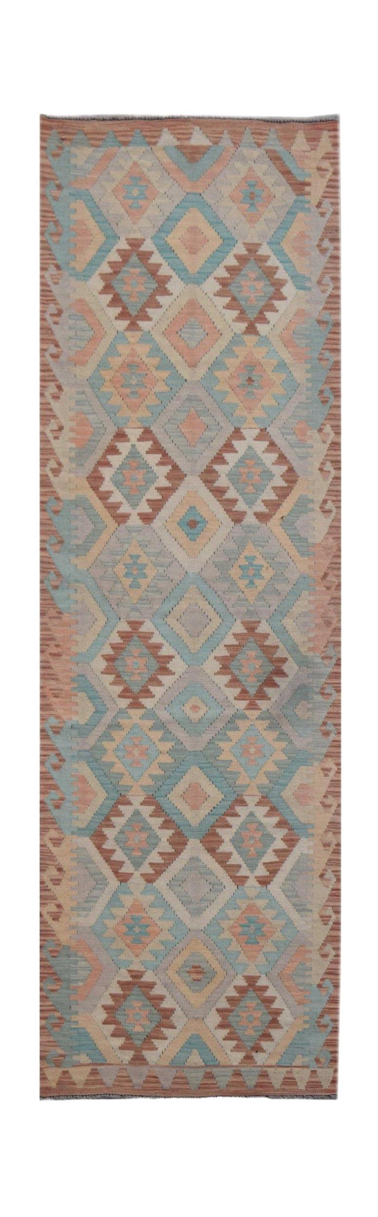 Handmade Afghan Maimana wool runner rug featuring a geometric diamond pattern in muted earth tones.