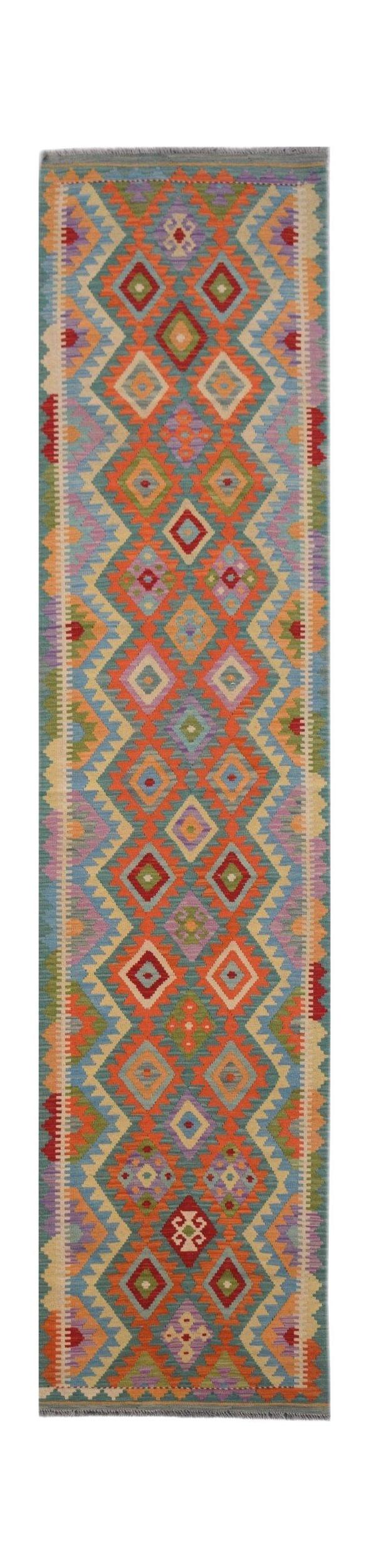Handmade Afghan Maimana wool runner rug featuring a vibrant geometric diamond pattern.