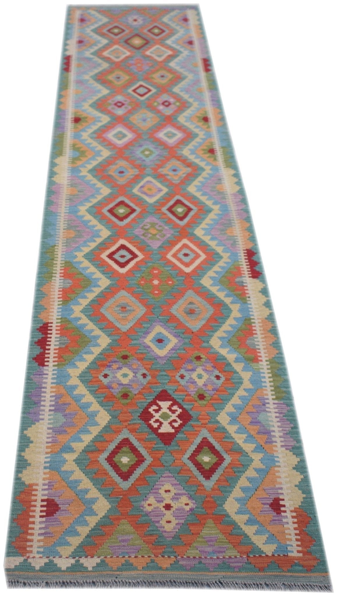 Handmade Afghan Maimana wool runner rug featuring a colorful geometric diamond pattern.