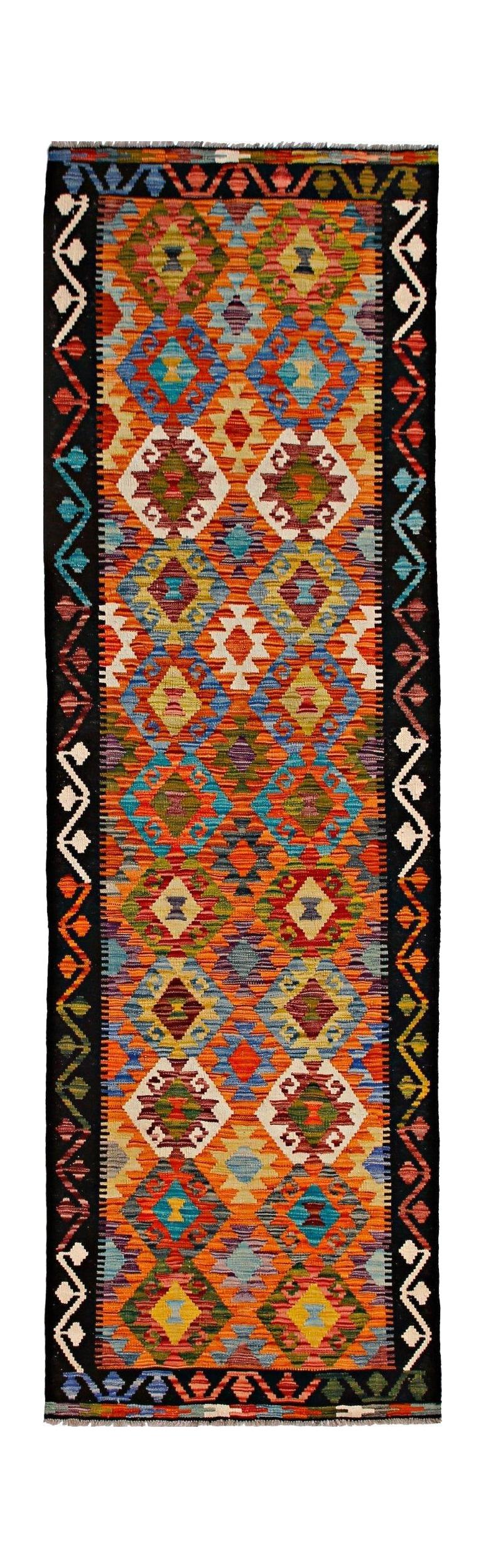 Handwoven Afghan Maimana wool runner featuring a vibrant geometric diamond pattern.