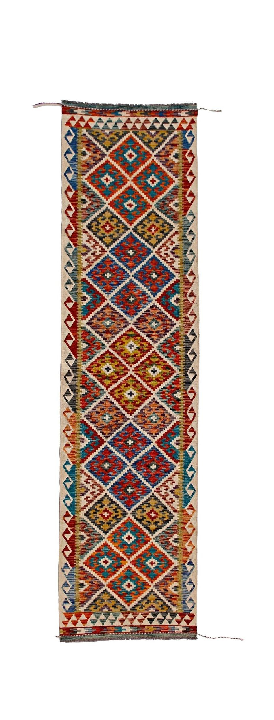 Handwoven Afghan Maimana wool runner rug featuring a colorful geometric diamond pattern.