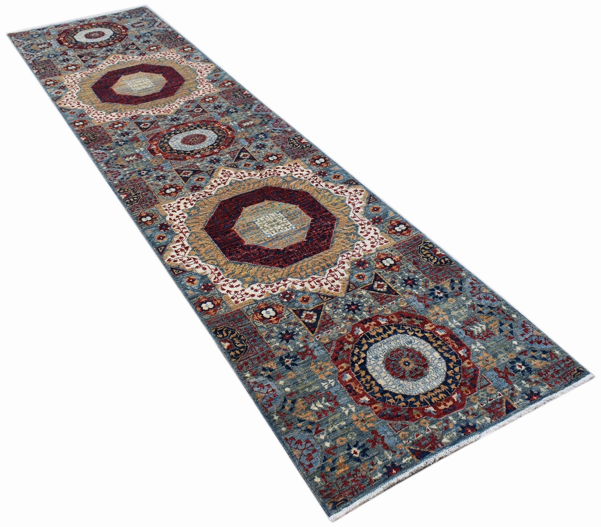 A handmade Afghan Chobi runner rug featuring a traditional Mamluk medallion pattern in blue and red.